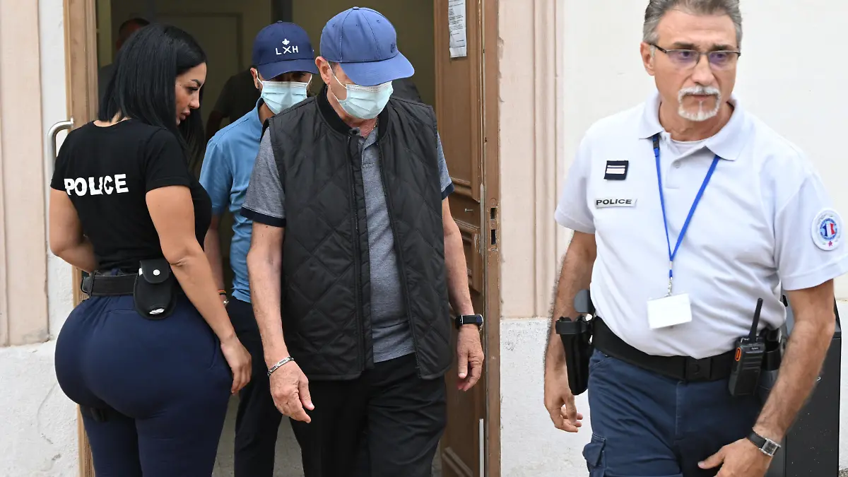 French ex-dentists Lionel (back) and his father Carnot Guedj (2nd R), accused of fraud and dental mutilation arrive at the courthouse on the trial voting and sentencing's day in Marseille, southern France, on September 8, 2022. - Lionel Guedj was sentenced on September 8, 2022 in Marseille to eight years in prison with an immediate committal order for having mutilated hundreds of patients, while enriching himself on the Social Security and mutual insurance companies. (Photo by Christophe SIMON / AFP) (Photo by CHRISTOPHE SIMON/AFP via Getty Images)