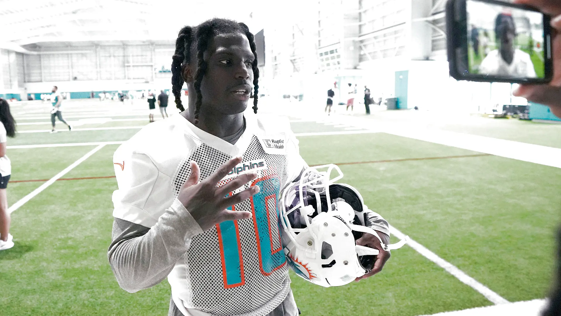 Miami Dolphins wide receiver Tyreek Hill (10) takes questions from the media following NFL football practice, Thursday, June 8, 2023, in Miami Gardens, Fla. (AP Photo/Jim Rassol)