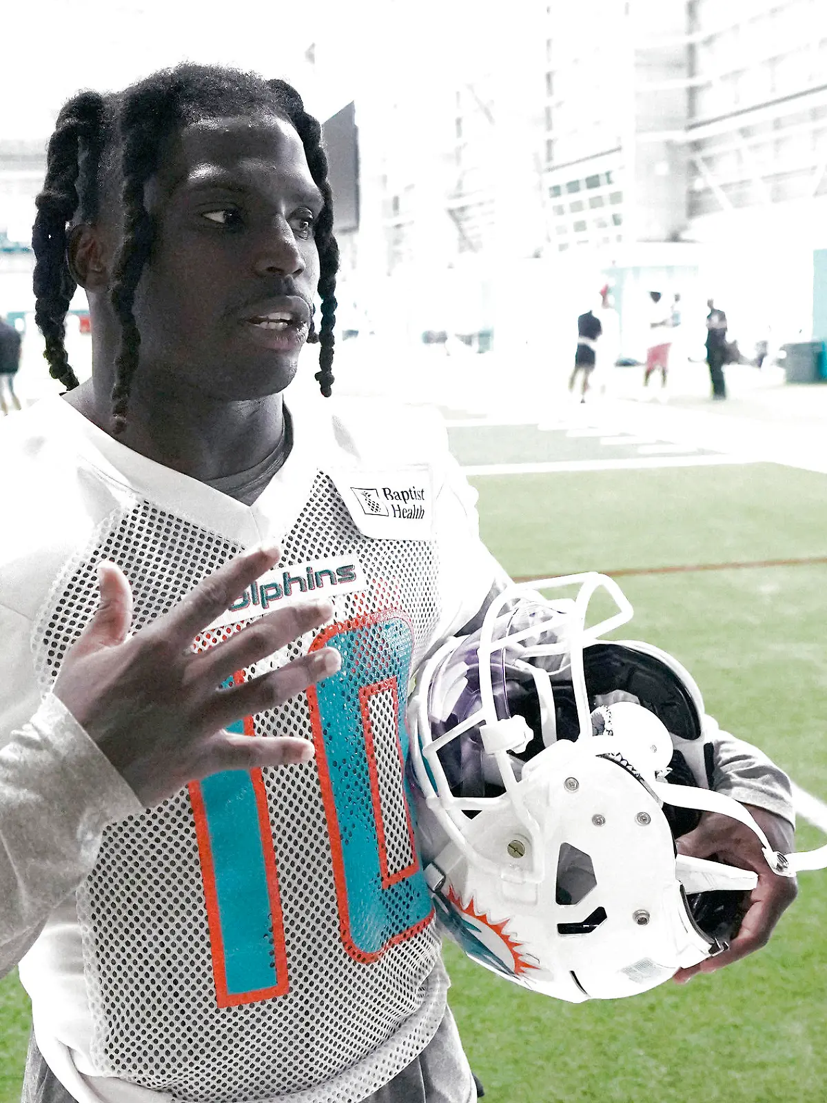 Miami Dolphins wide receiver Tyreek Hill (10) takes questions from the media following NFL football practice, Thursday, June 8, 2023, in Miami Gardens, Fla. (AP Photo/Jim Rassol)
