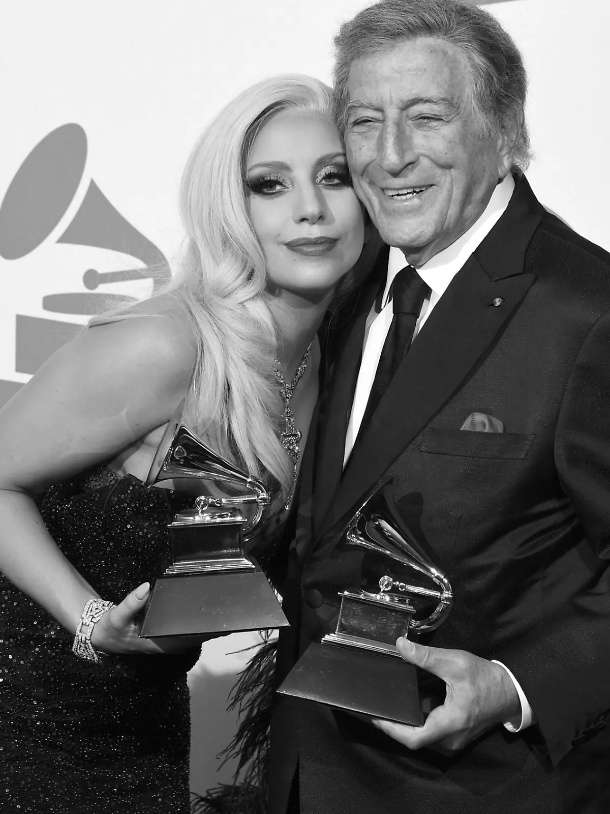 FILE - Lady Gaga, left, and Tony Bennett pose in the press room with the award for best traditional pop vocal album for "Cheek to Cheek" at the 57th annual Grammy Awards at the Staples Center on Sunday, Feb. 8, 2015, in Los Angeles. Bennett, the eminent and timeless stylist whose devotion to classic American songs and knack for creating new standards such as "I Left My Heart In San Francisco" graced a decadeslong career that brought him admirers from Frank Sinatra to Lady Gaga, died Friday, July 21, 2023. He was 96. (Photo by Chris Pizzello/Invision/AP, File)