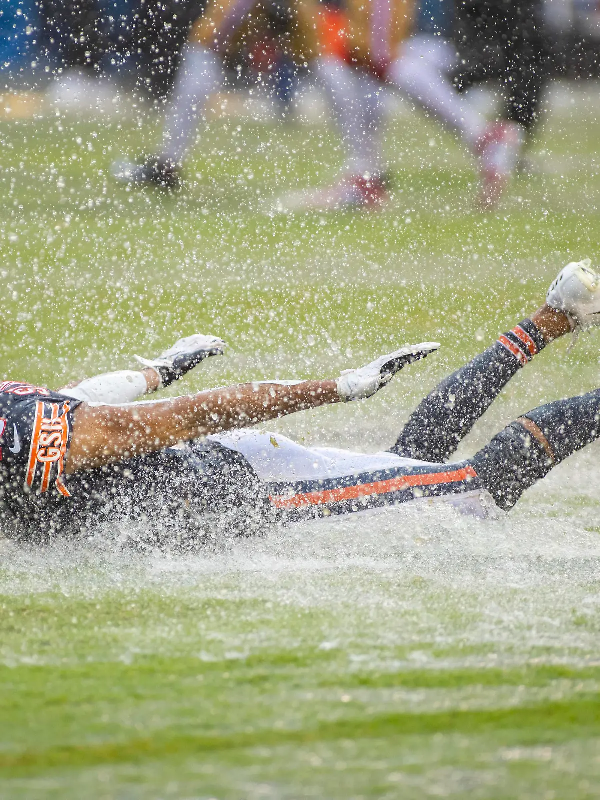 September 11, 2022: Chicago, Illinois, U.S. - Chicago Bears 19 Equanimeous St. Brown slides on the wet turf celebrating the win after the game between the San Francisco 49ers and the Chicago Bears at Soldier Field in Chicago, IL. Chicago United States of America - ZUMAc04_ 20220911_zaf_c04_182 Copyright: xMikexWulfx 