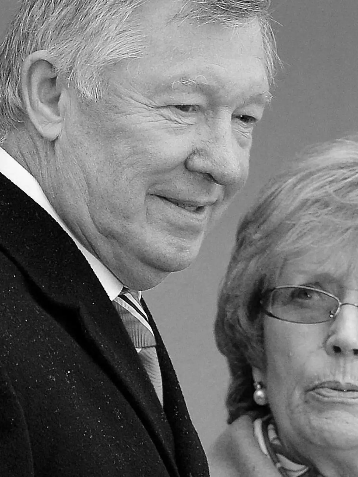 FILE PHOTO: Manchester United's manager Alex Ferguson and his wife Cathy attend the unveiling of a sculpture commemorating his career at the club, at Old Trafford stadium in Manchester, northern England November 23, 2012. REUTERS/Nigel Roddis/File Photo