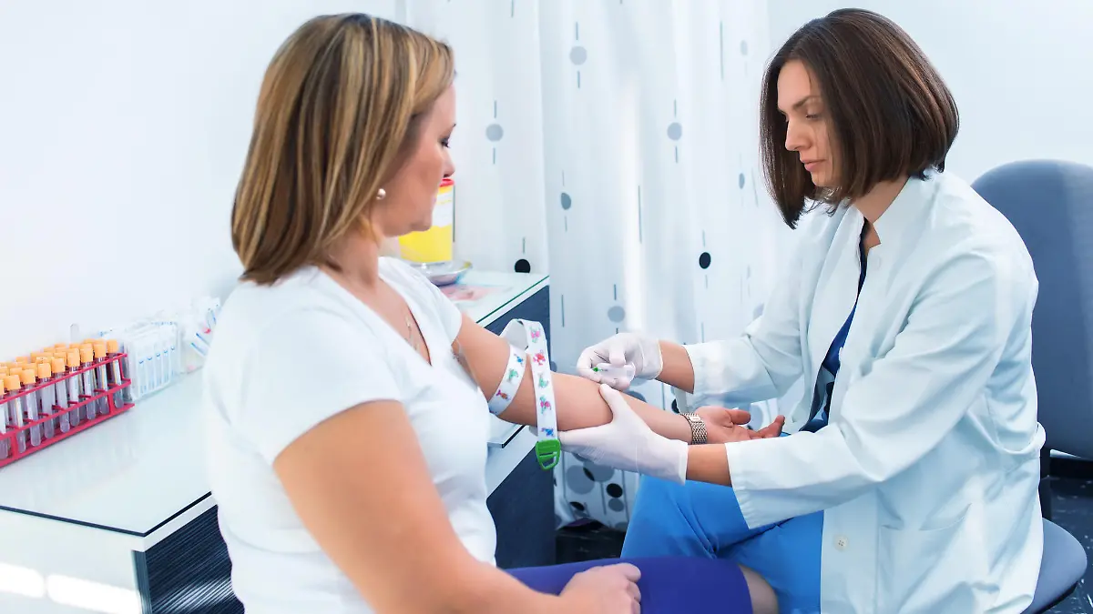 Nurse getting blood from on a female donor