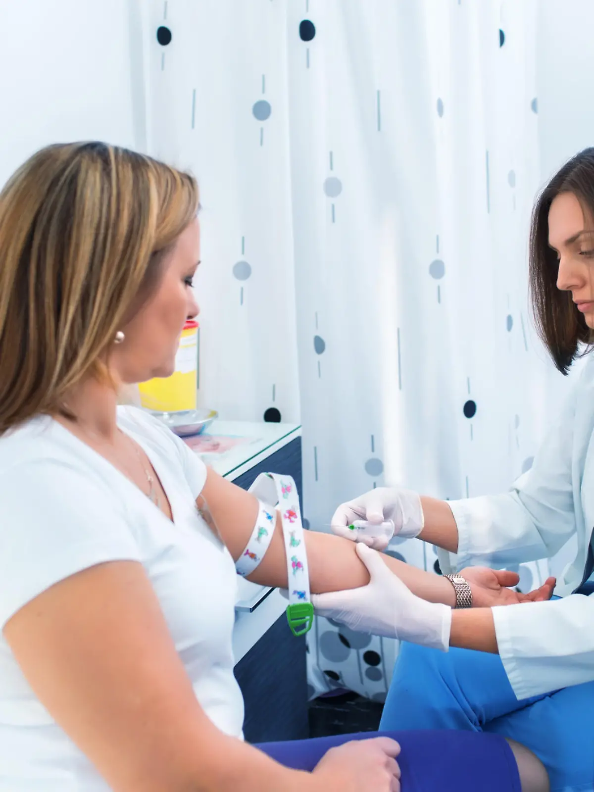 Nurse getting blood from on a female donor