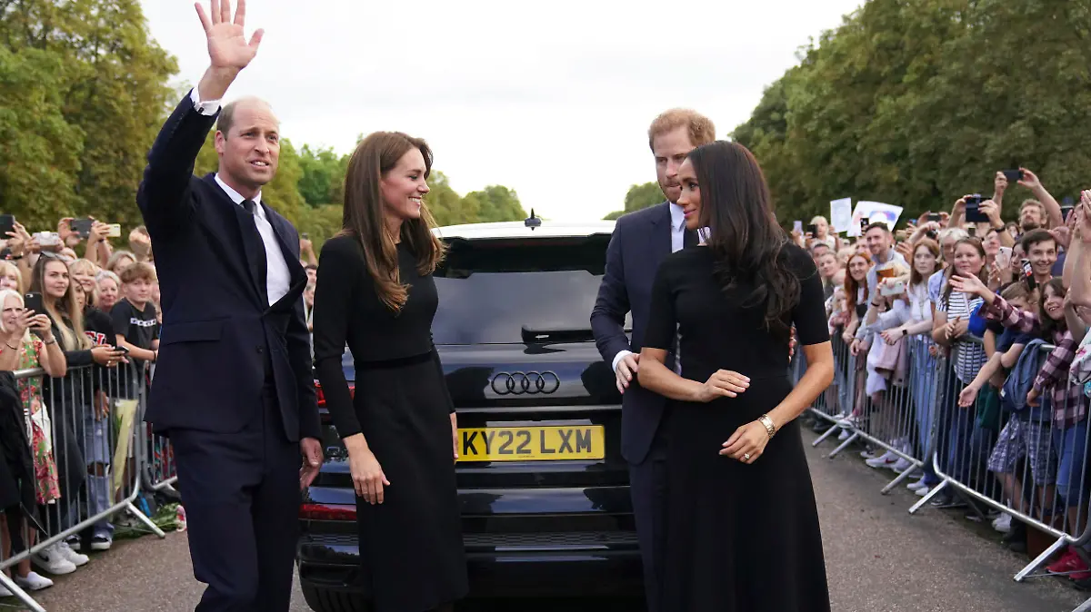 From left, Britain's Prince William, Prince of Wales, Kate, Princess of Wales, Prince Harry and Meghan, Duchess of Sussex meet members of the public at Windsor Castle, following the death of Queen Elizabeth II on Thursday, in Windsor, England, Saturday, Sept. 10, 2022. (Kirsty O'Connor/Pool Photo via AP)