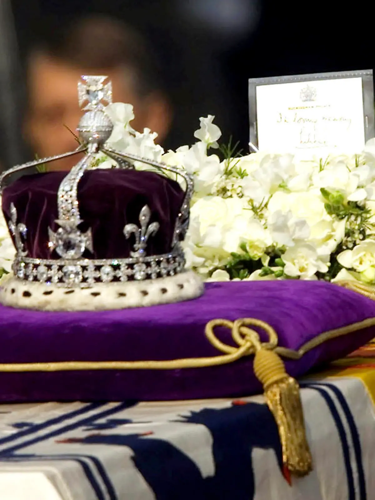 FILE- in this April 5, 2002 file photo, The Koh-i-noor, or "mountain of light," diamond, set in the Maltese Cross at the front of the crown made for Britain's late Queen Mother Elizabeth, is seen on her coffin, along with her personal standard, a wreath and a note from her daughter, Queen Elizabeth II, as it is drawn to London's Westminster Hall. India's government has told the country's top court it won't try to reclaim the 106-carat Koh-i-Noor diamond, which is now part of the British crown jewels.The government told the Supreme Court on Monday that the diamond was neither taken away forcibly nor stolen, but was given as a gift to Queen Victoria by an Indian king in the mid-19th century. (AP Photo/Alastair Grant, File)