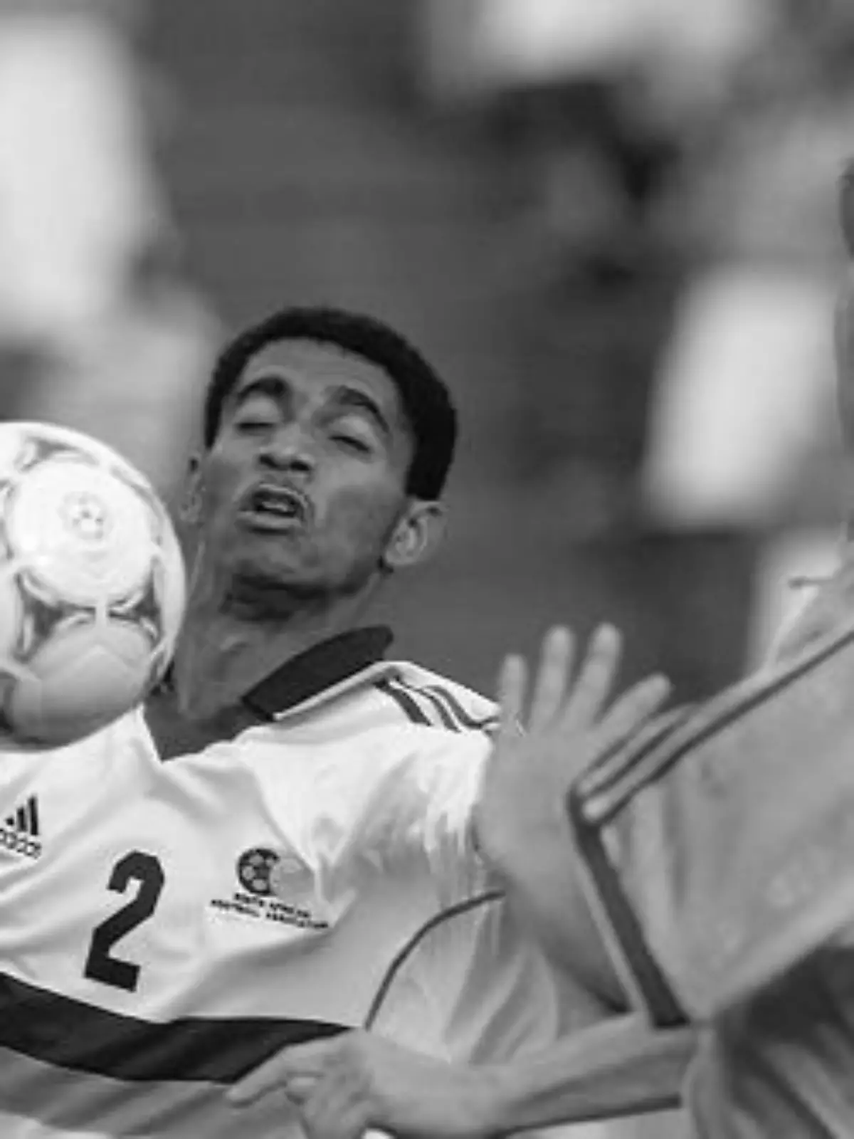 South African defender Papi Khomane (L) receives the ball and is challenged by two Swedish players (R) during  a friendly soccer match between South Africa and Sweden at Lofthus stadium in Pretoria, 27 November 1999. South Africa won 1-0. (ELECTRONIC IMAGE) AFP PHOTO (Photo by Odd ANDERSEN / AFP) (Photo by ODD ANDERSEN/AFP via Getty Images)