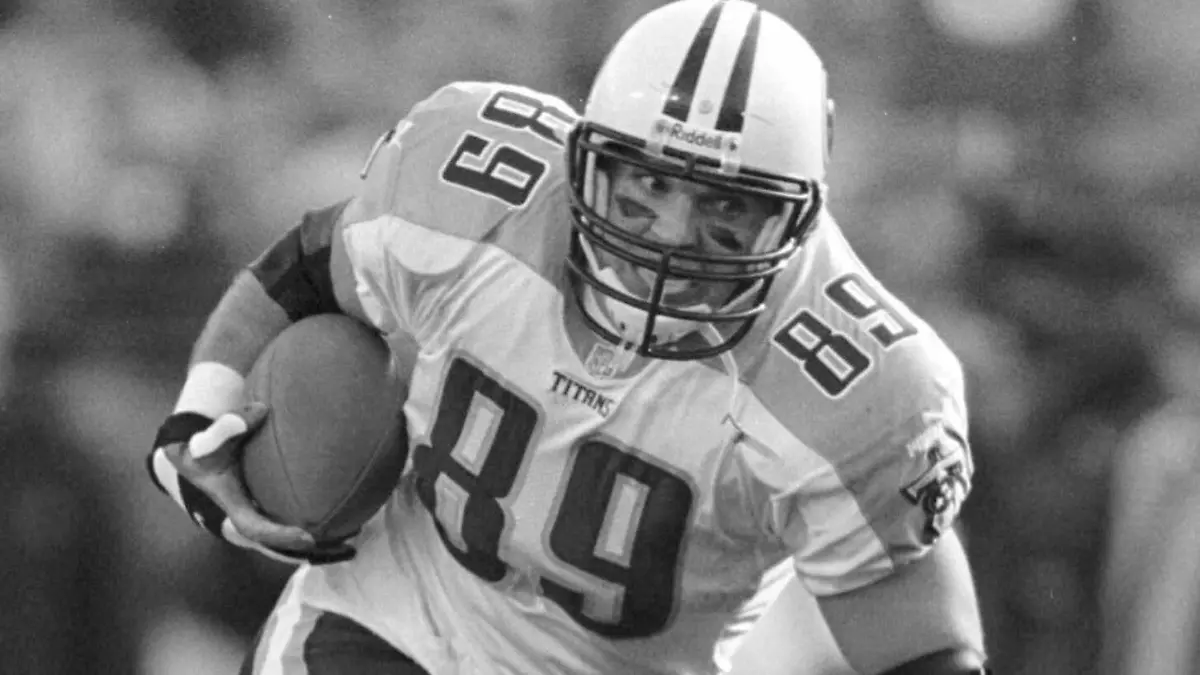 FILE - Tennessee Titans tight end Frank Wycheck runs with the ball during a football game against the Baltimore Ravens, Dec. 5, 1999, in Baltimore. The three-time Pro Bowler Wycheck, who threw the lateral that started the “Music City Miracle” launching the Tennessee Titans' run to the franchise's lone Super Bowl appearance, has died at age 52. Wycheck died at his Chattanooga, Tenn., home after an apparent fall where he hit his head Saturday morning, Dec. 9, 2023, according to a statement from his family released through the Legacy consulting firm. (AP Photo/Roberto Borea, File)