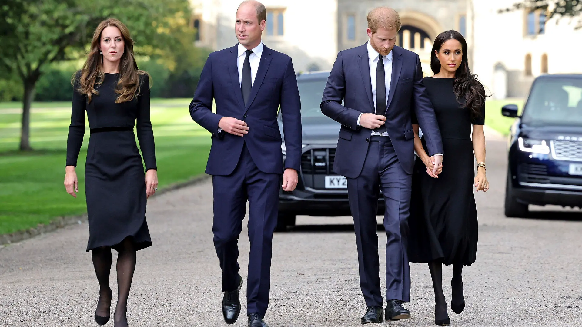 From left, Britain's Kate, Princess of Wales, Prince William, Prince of Wales, Prince Harry, and Meghan, Duchess of Sussex walk to meet members of the public, at Windsor Castle, following the death of Queen Elizabeth II on Thursday, in Windsor, England, Saturday, Sept. 10, 2022. (Chris Jackson/Pool Photo via AP)