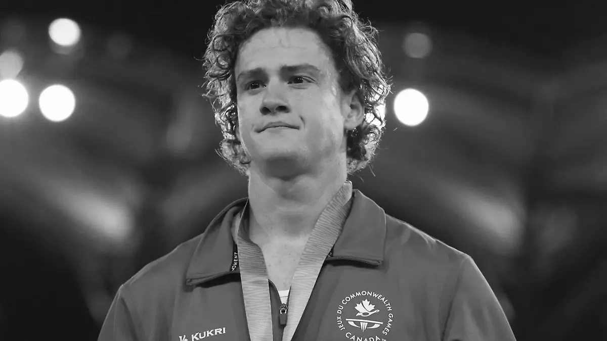 FILE - Men's pole vault silver medalist Canada's Shawnacy Barber is shown on the podium at Carrara Stadium during the 2018 Commonwealth Games on the Gold Coast, Australia, Thursday, April 12, 2018. Barber has died from medical complications. He was 29. Barber died Wednesday, Jan. 17, 2024, at home in Kingwood, Texas, his agent, Paul Doyle, confirmed to The Associated Press. (AP Photo/Mark Schiefelbein, File)