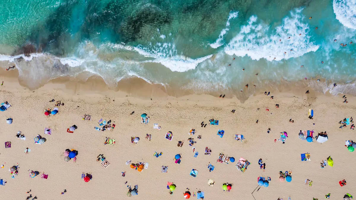 Spain, Mallorca, Cala Mesquida, Aerial view of people relaxing on Cala Agulla beach in summer AMF08433