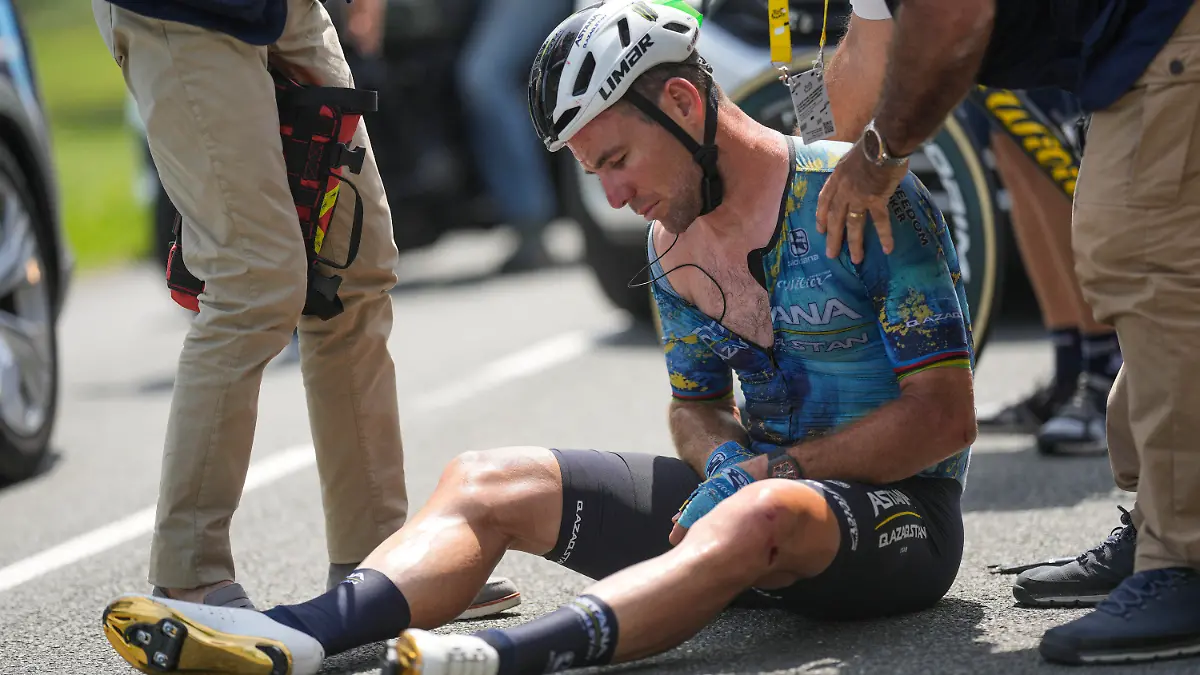 Britain's Mark Cavendish receives medical assistance after crashing during the eighth stage of the Tour de France cycling race over 201 kilometers (125 miles) with start in Libourne and finish in Limoges, France, Saturday, July 8, 2023. (AP Photo/Thibault Camus)