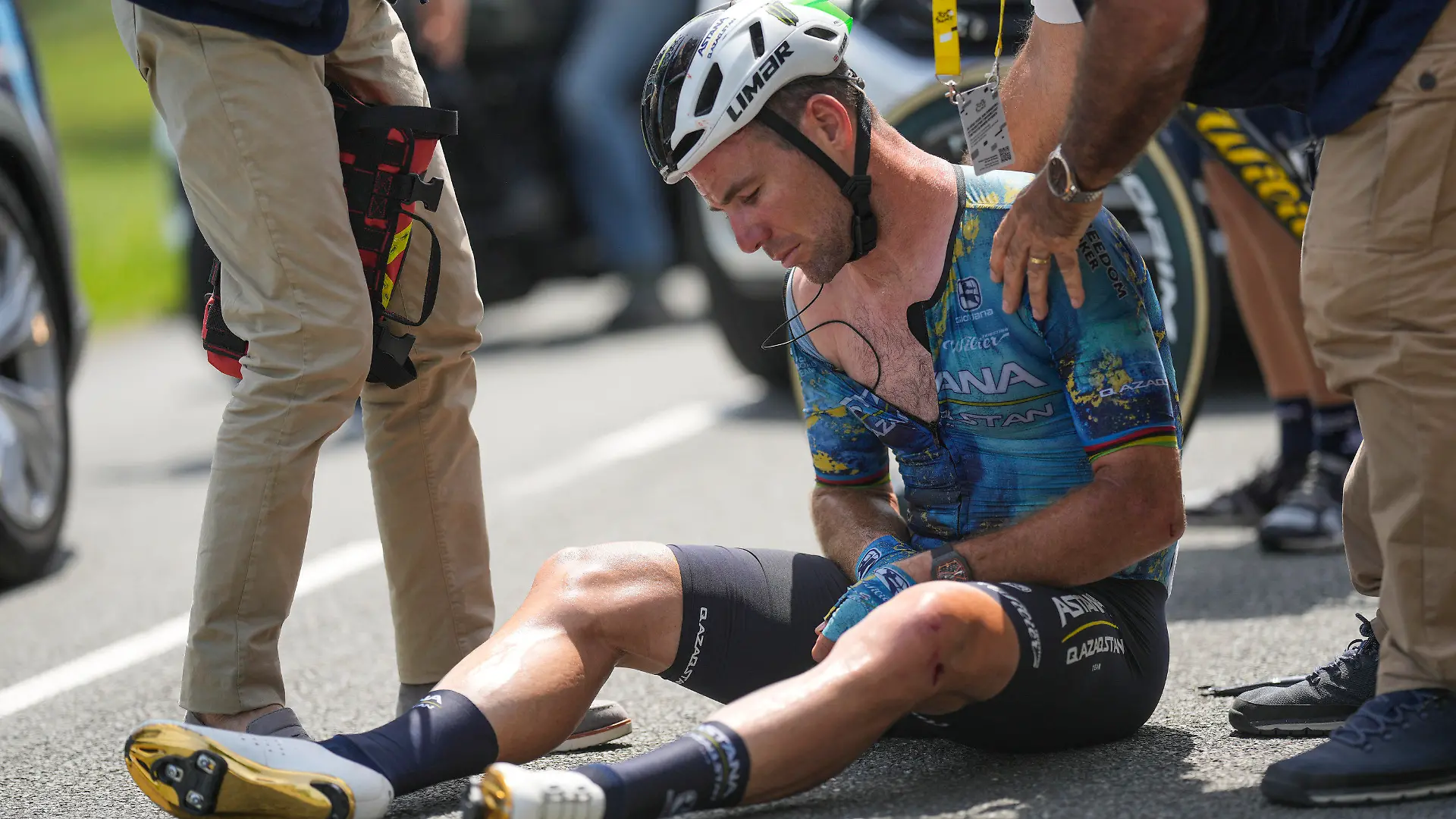 Britain's Mark Cavendish receives medical assistance after crashing during the eighth stage of the Tour de France cycling race over 201 kilometers (125 miles) with start in Libourne and finish in Limoges, France, Saturday, July 8, 2023. (AP Photo/Thibault Camus)