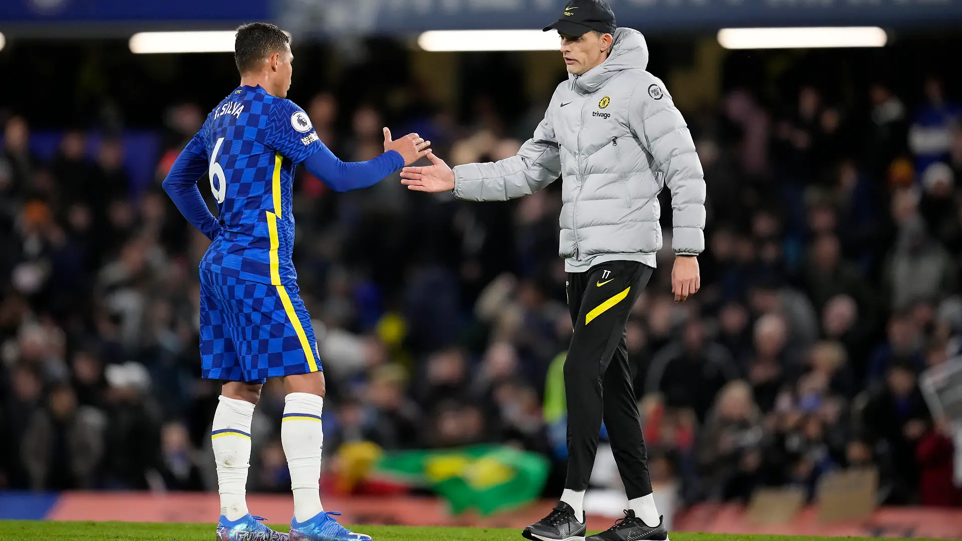 Chelsea's head coach Thomas Tuchel greets Chelsea's Thiago Silva after the English Premier League soccer match between Chelsea and Liverpool at Stamford Bridge in London, Sunday, Jan. 2, 2022. The match ended in a 2-2 draw. (AP Photo/Matt Dunham)
