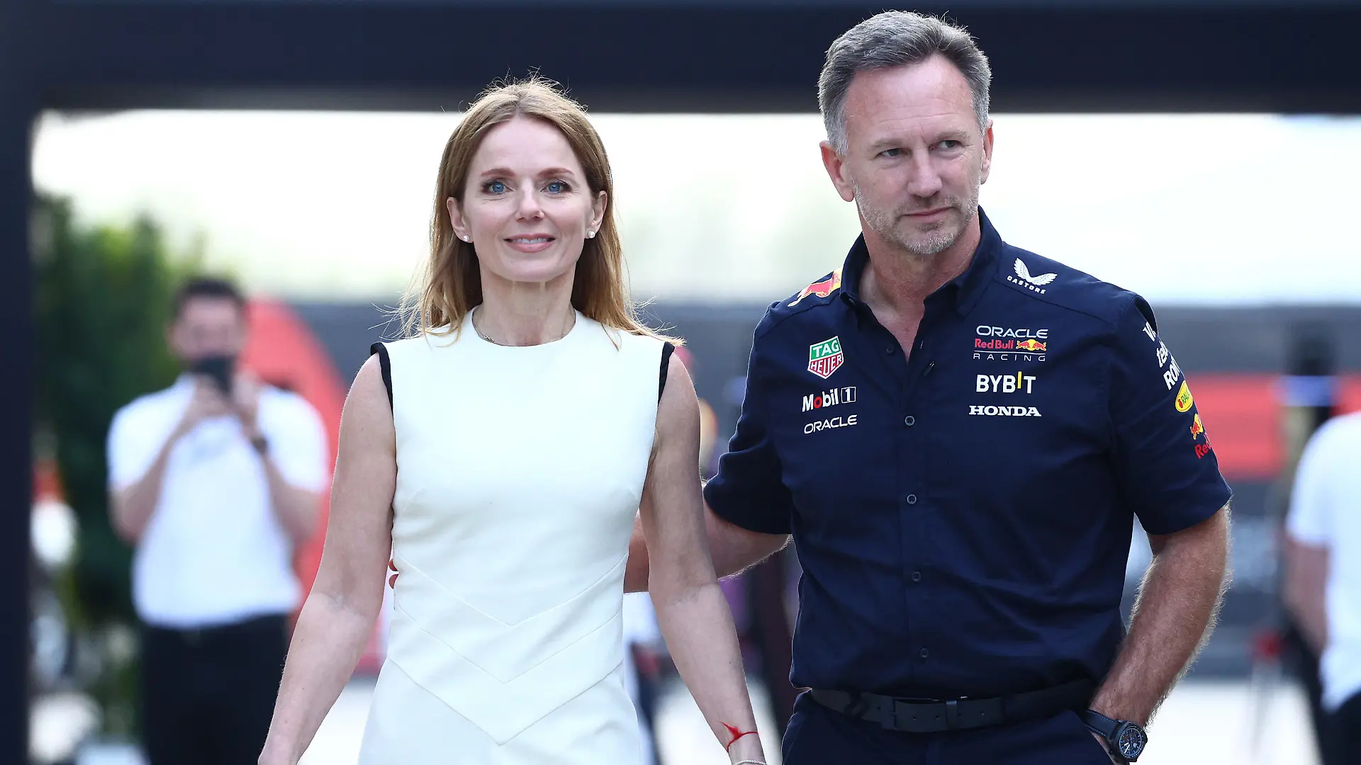 BAHRAIN, BAHRAIN - MARCH 02: Oracle Red Bull Racing Team Principal Christian Horner and Geri Horner walk in the Paddock holding hands prior to the F1 Grand Prix of Bahrain at Bahrain International Circuit on March 02, 2024 in Bahrain, Bahrain. (Photo by Clive Rose/Getty Images)