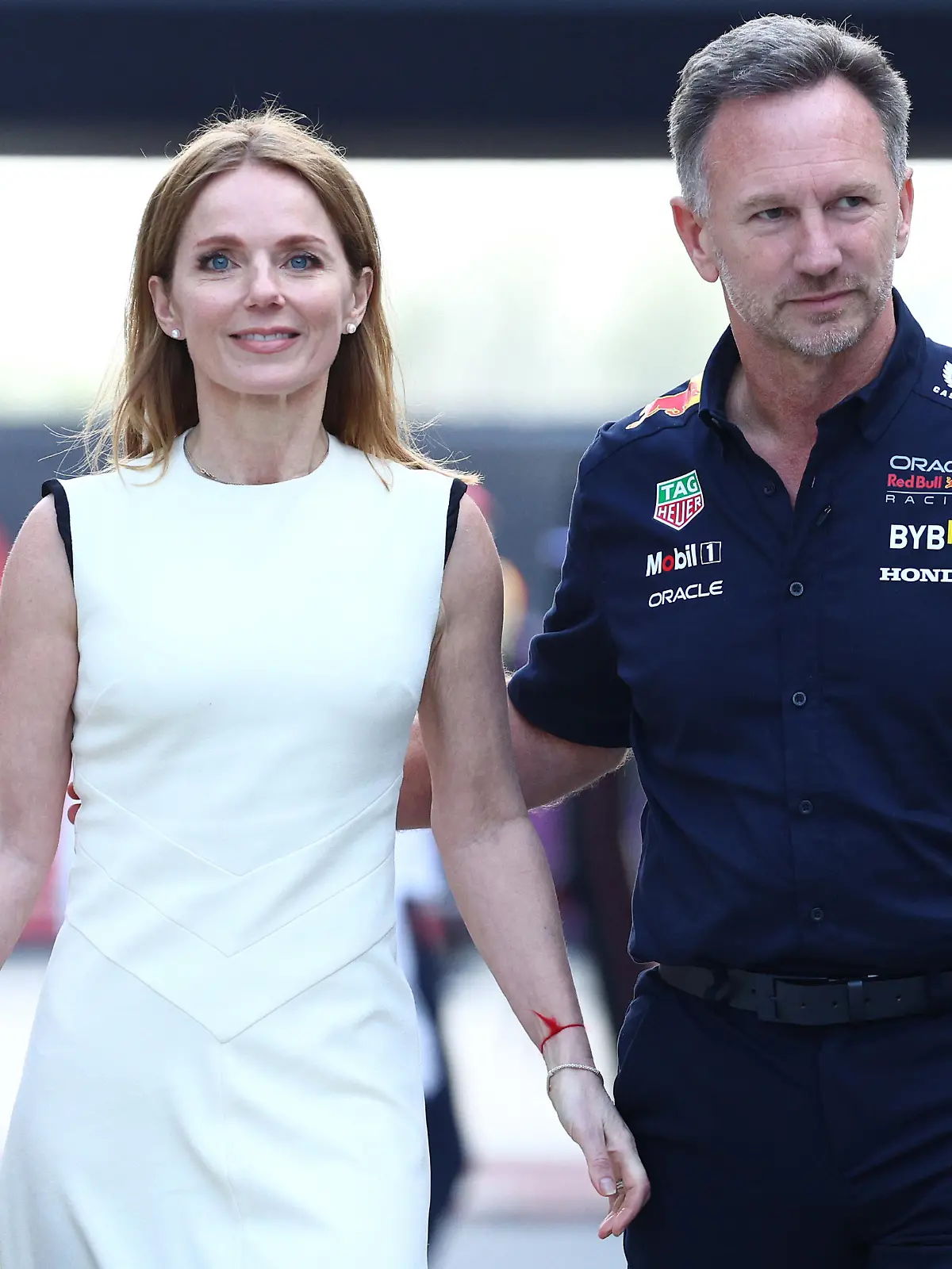 BAHRAIN, BAHRAIN - MARCH 02: Oracle Red Bull Racing Team Principal Christian Horner and Geri Horner walk in the Paddock holding hands prior to the F1 Grand Prix of Bahrain at Bahrain International Circuit on March 02, 2024 in Bahrain, Bahrain. (Photo by Clive Rose/Getty Images)