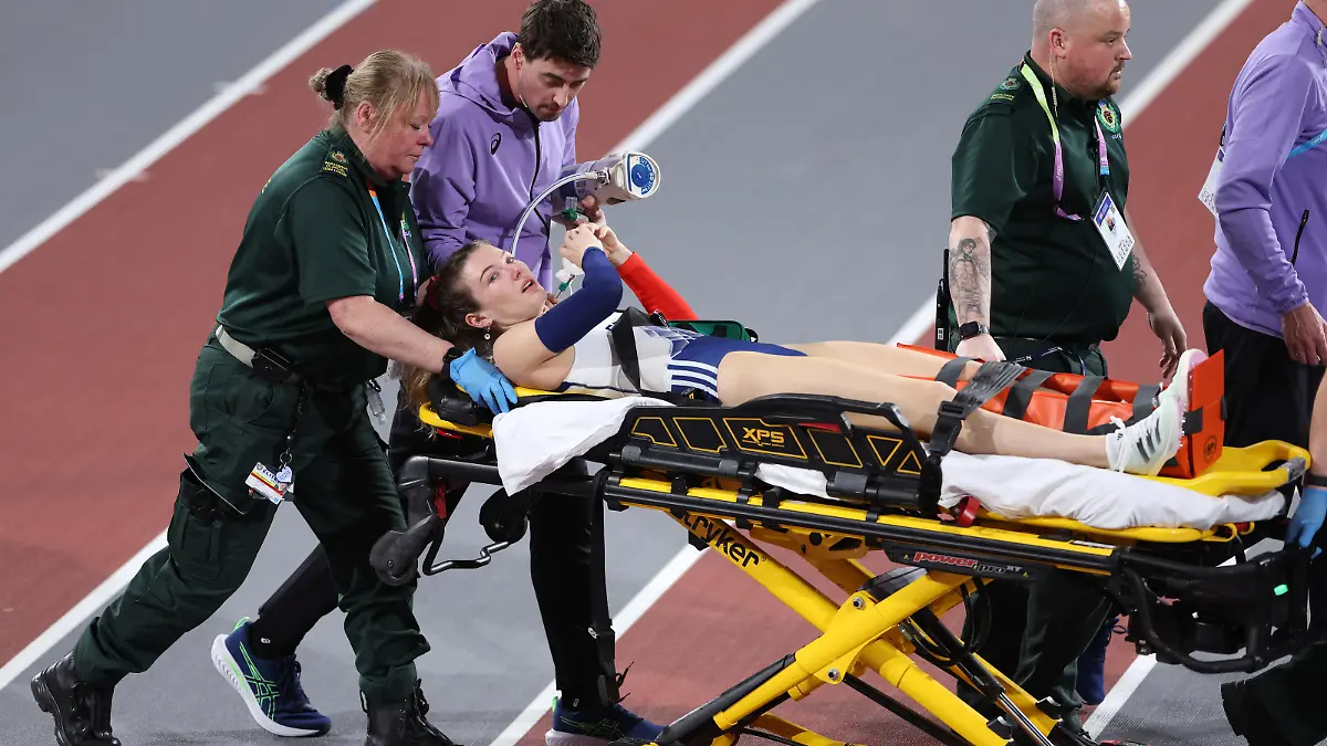 GLASGOW, SCOTLAND - MARCH 02: Margot Chevrier of Team France is stretchered off after an injury in the approach during a jump in the Women's Pole Vault Final on Day Two of the World Athletics Indoor Championships at Emirates Arena on March 02, 2024 in Glasgow, Scotland. (Photo by Alex Pantling/Getty Images)