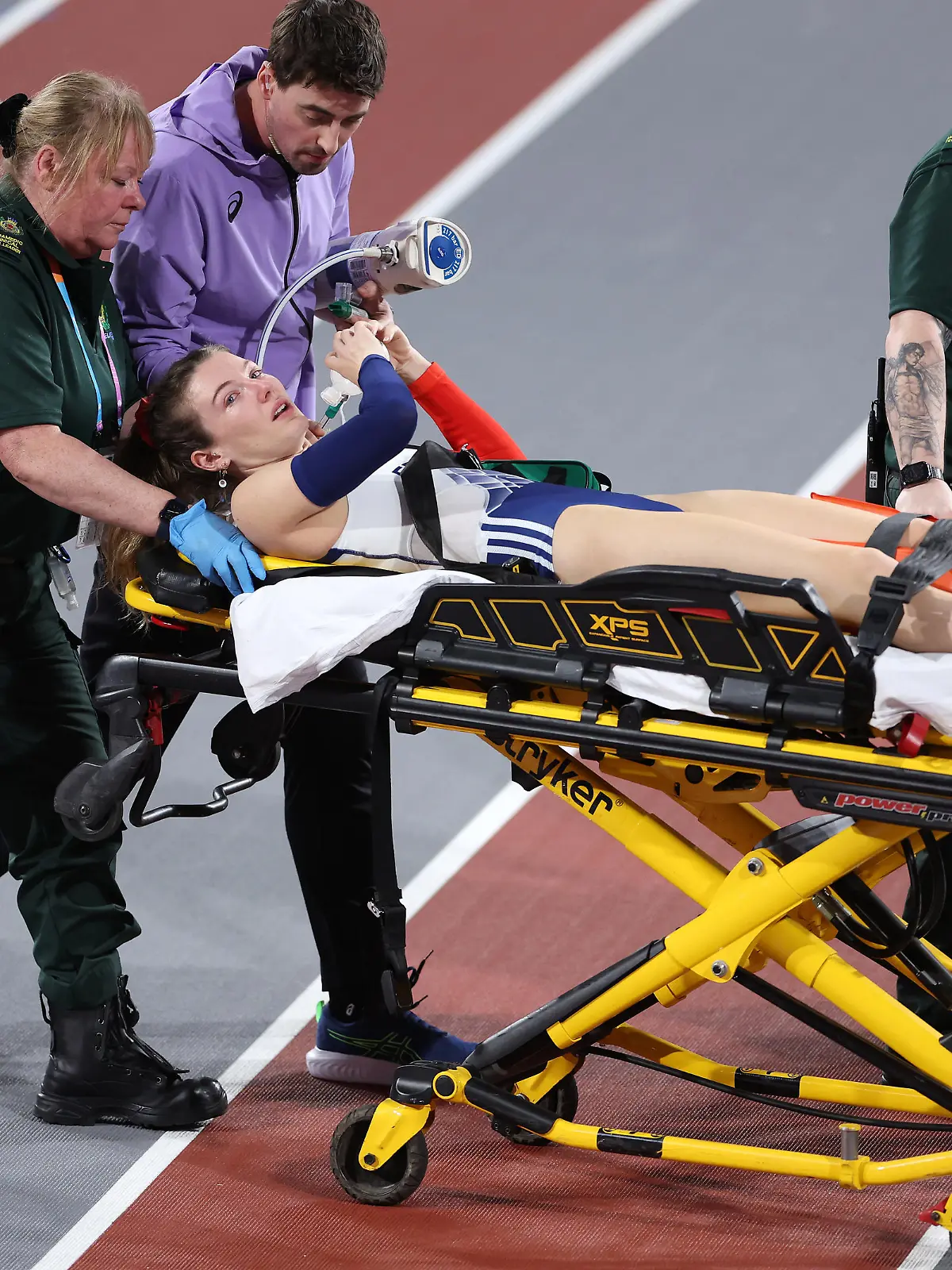 GLASGOW, SCOTLAND - MARCH 02: Margot Chevrier of Team France is stretchered off after an injury in the approach during a jump in the Women's Pole Vault Final on Day Two of the World Athletics Indoor Championships at Emirates Arena on March 02, 2024 in Glasgow, Scotland. (Photo by Alex Pantling/Getty Images)