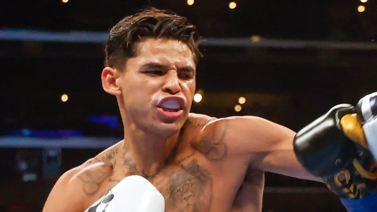 FILE - Ryan Garcia, left, hits Javier Fortuna, right, during a lightweight boxing bout July 16, 2022, in Los Angeles. The fighters seemed just as surprised as fight fans when it was announced that Garcia and Devin Haney, two Californians, would have their April 20, 2024, title fight in New York. But Oscar De La Hoya, Garcia’s promoter, says bringing the event to Brooklyn is common sense. (AP Photo/Ringo H.W. Chiu, File)