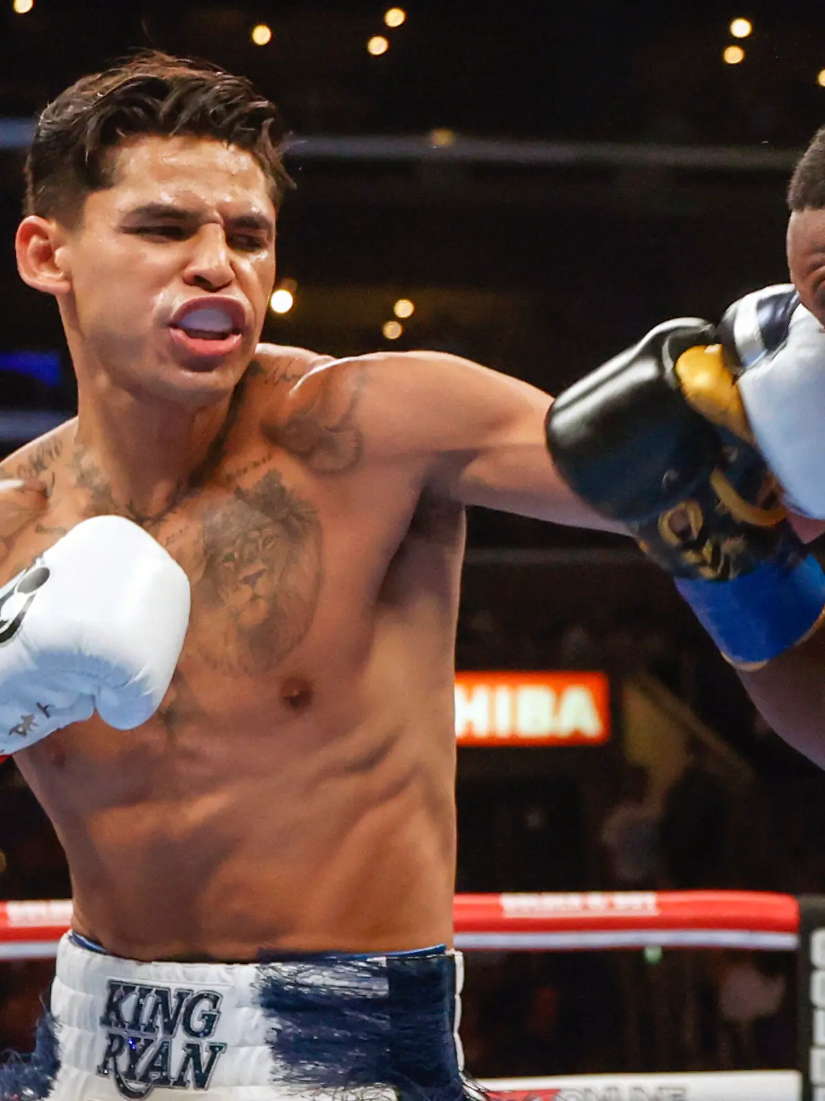 FILE - Ryan Garcia, left, hits Javier Fortuna, right, during a lightweight boxing bout July 16, 2022, in Los Angeles. The fighters seemed just as surprised as fight fans when it was announced that Garcia and Devin Haney, two Californians, would have their April 20, 2024, title fight in New York. But Oscar De La Hoya, Garcia’s promoter, says bringing the event to Brooklyn is common sense. (AP Photo/Ringo H.W. Chiu, File)