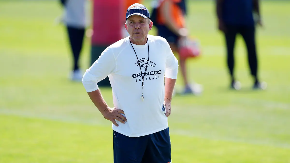 Denver Broncos head coach Sean Payton looks on as players take part in drills during an NFL football training camp Thursday, July 27, 2023, in Centennial, Colo. (AP Photo/David Zalubowski)