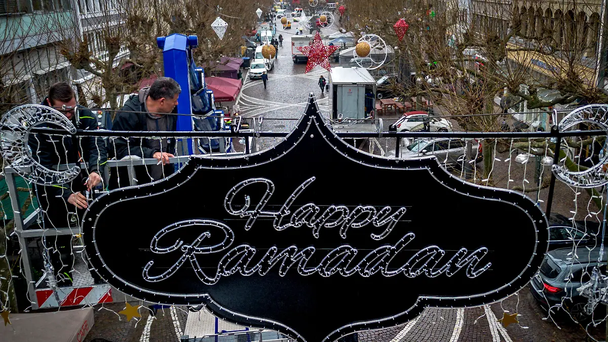 "Happy Ramadan" is written on a sign hanging above a pedestrian zone in Frankfurt, Germany, Tuesday, March 5, 2024. The city of Frankfurt had the lights put up to mark the upcoming Ramadan. (AP Photo/Michael Probst)