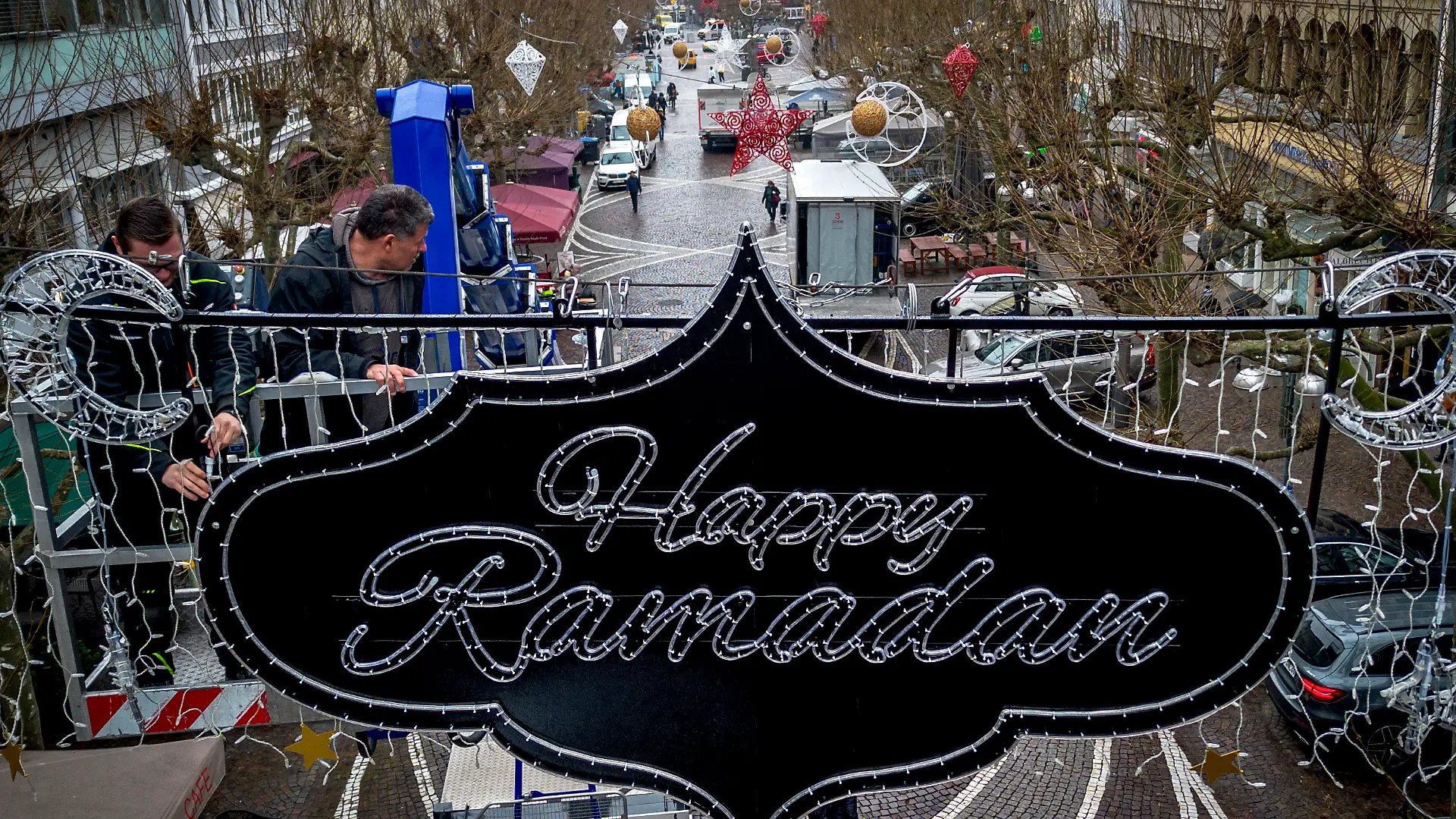 "Happy Ramadan" is written on a sign hanging above a pedestrian zone in Frankfurt, Germany, Tuesday, March 5, 2024. The city of Frankfurt had the lights put up to mark the upcoming Ramadan. (AP Photo/Michael Probst)