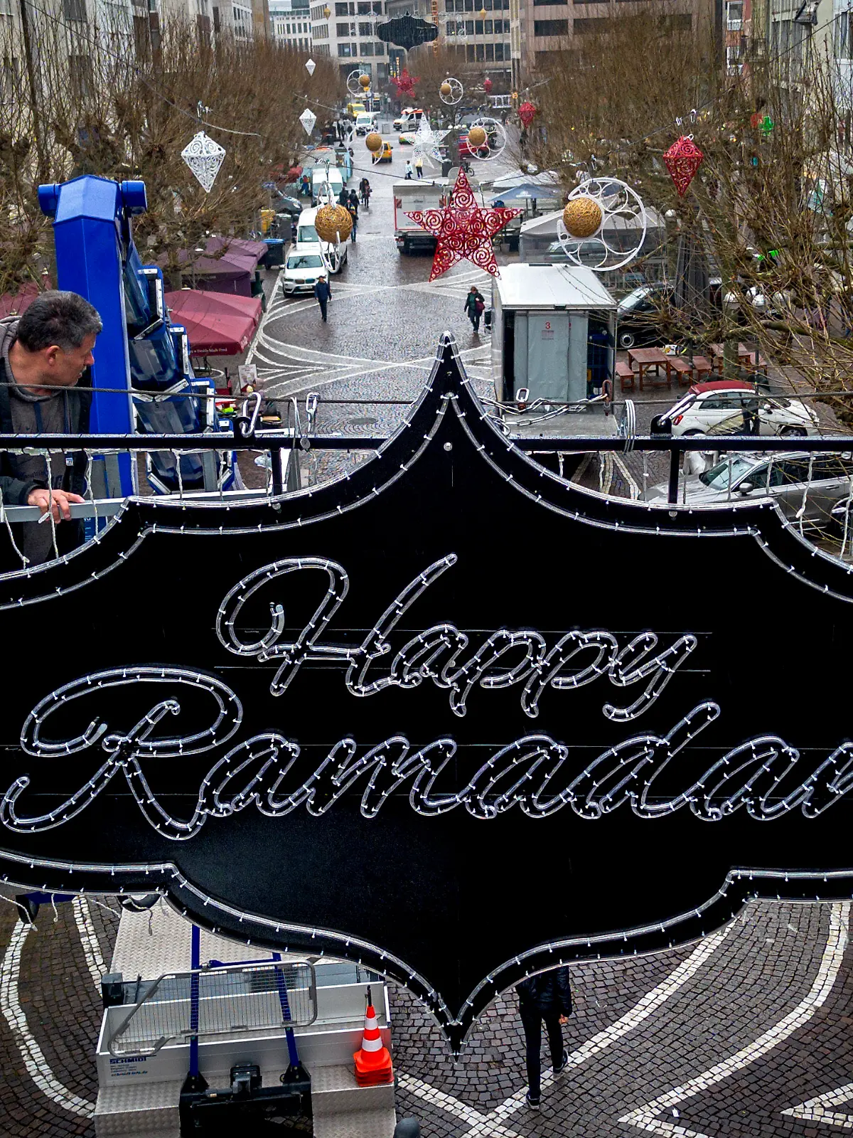 "Happy Ramadan" is written on a sign hanging above a pedestrian zone in Frankfurt, Germany, Tuesday, March 5, 2024. The city of Frankfurt had the lights put up to mark the upcoming Ramadan. (AP Photo/Michael Probst)