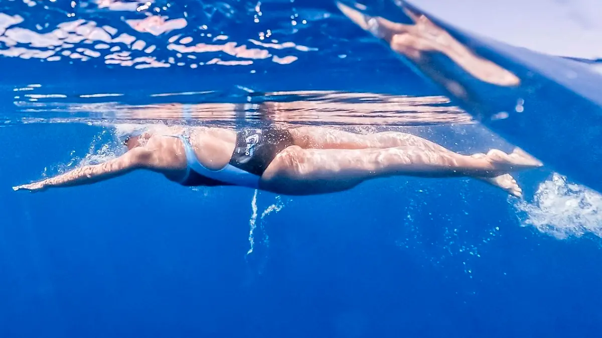 In this image released on Thursday, June 10th 2021, Nathalie Pohl swims the Menorca Channel. Pohl's time of 9h50s was an hour faster than the previous record holder and only 26 minutes slower than the fastest man. HANDOUT IMAGE - please refer to special instructions. (Marc Le Cornu/NP-Invest GmbH/news aktuell via AP Images)