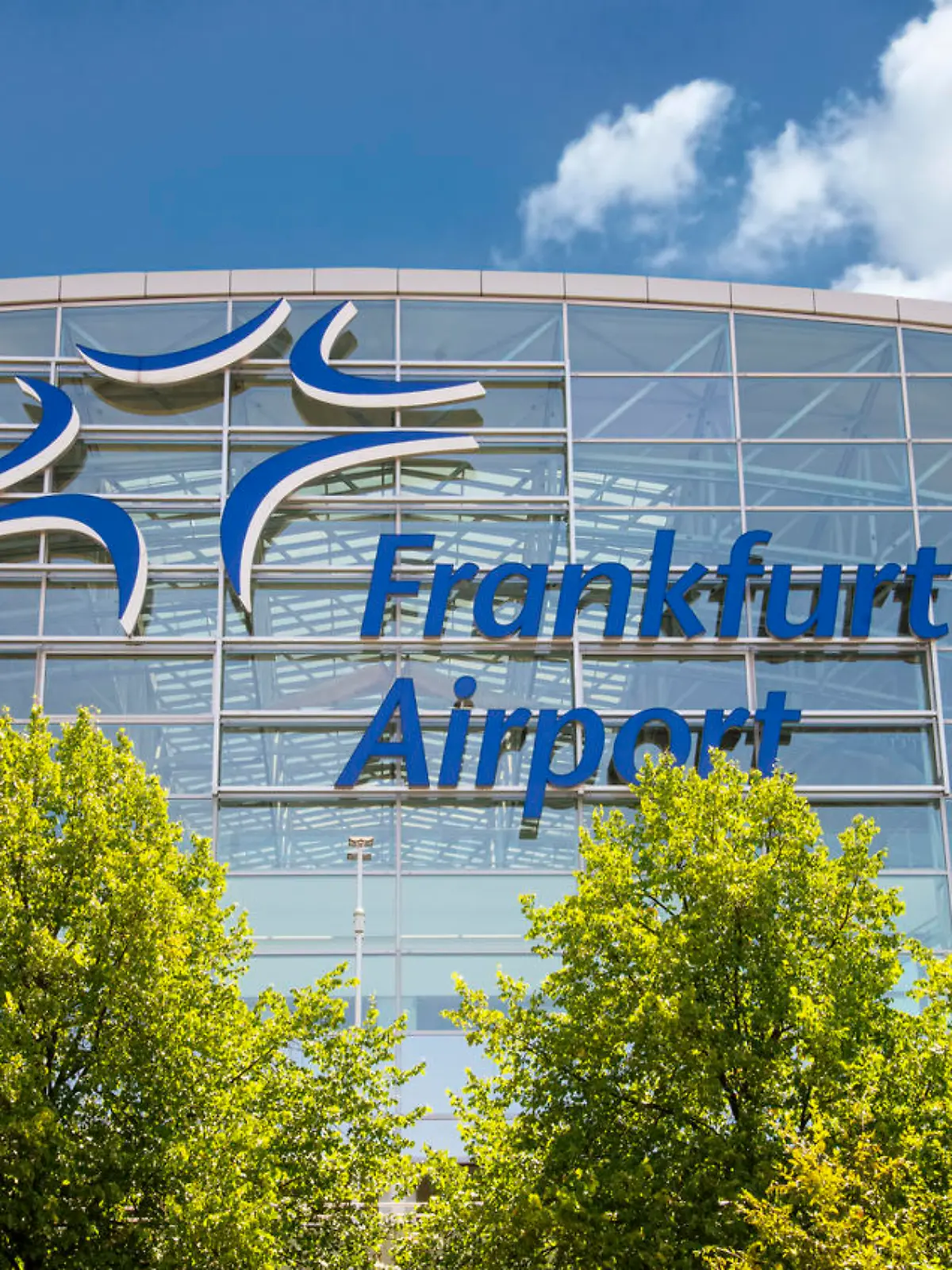 Frankfurt, Hesse, Germany - July 21, 2019: Facade of Terminal 2 at Frankfurt Airport with the Fraport logo