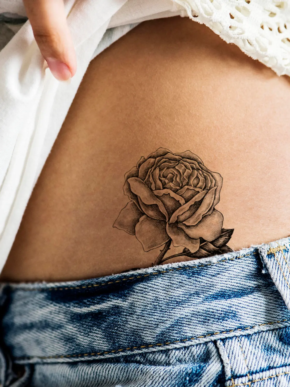 Closeup of lower hip tattoo of a woman
***This tattoo is derived from our own 3D generic designs. They do not infringe on any copyright design.
