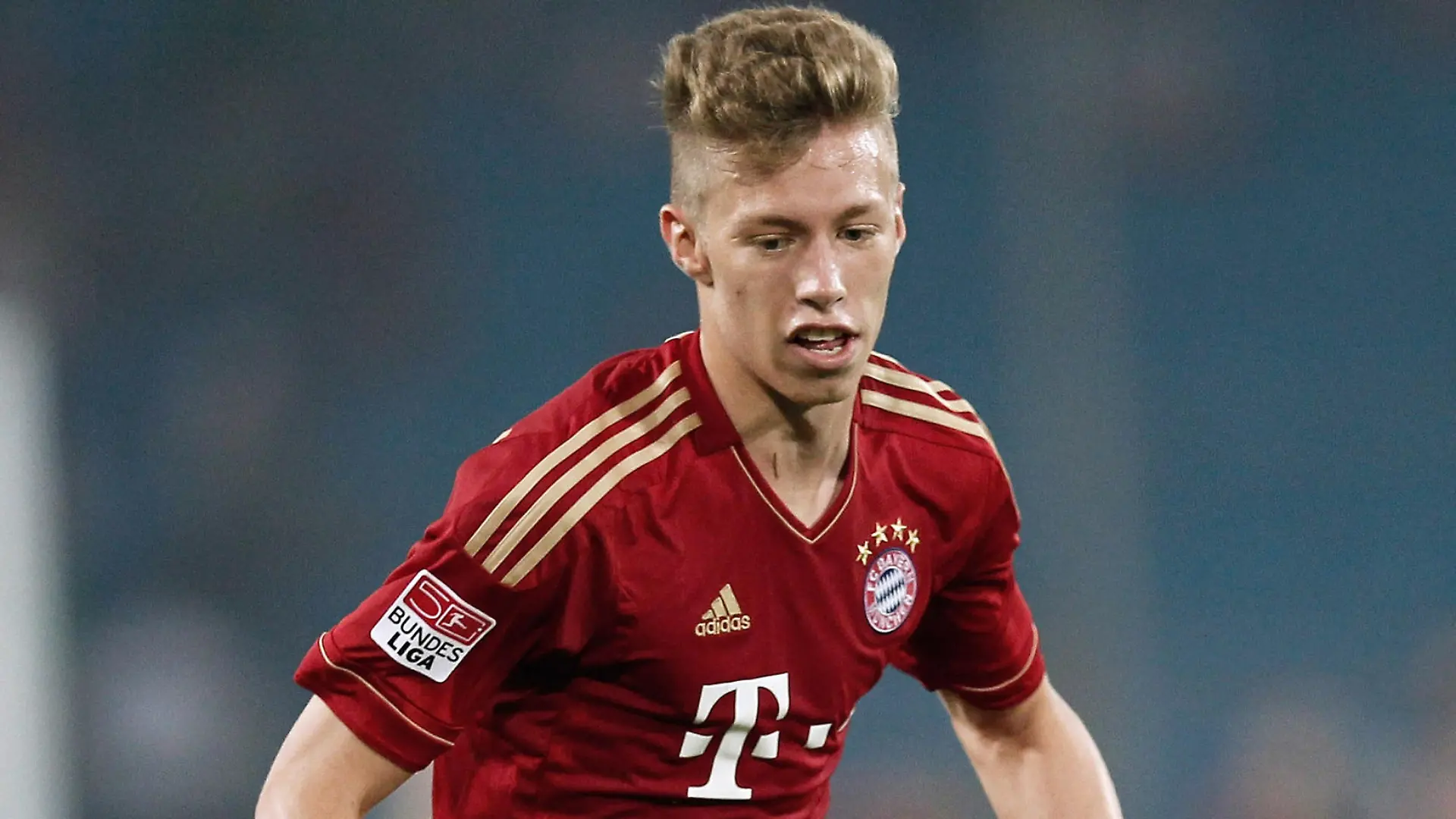 BEIJING, CHINA - JULY 24: Mitchell Weiser of FC Bayern Muenchen controls the ball during the pre-season friendly match between Beijing Guo'an and Bayern Muenchen at Beijing Workers Stadium on July 24, 2012 in Beijing, China.(Photo by Lintao Zhang/Getty Images)
