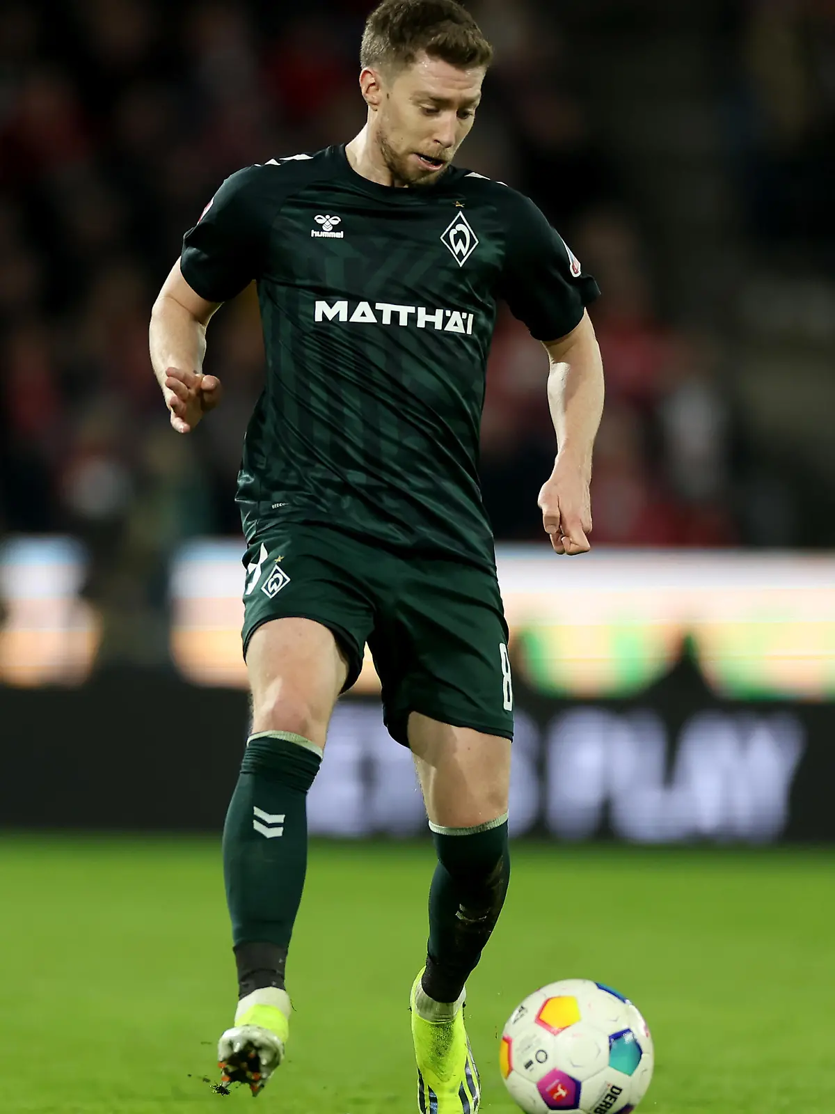 COLOGNE, GERMANY - FEBRUARY 16: Mitchell Weiser of Werder Bremen runs with the ball during the Bundesliga match between 1. FC Köln and SV Werder Bremen at RheinEnergieStadion on February 16, 2024 in Cologne, Germany. (Photo by Lars Baron/Getty Images)