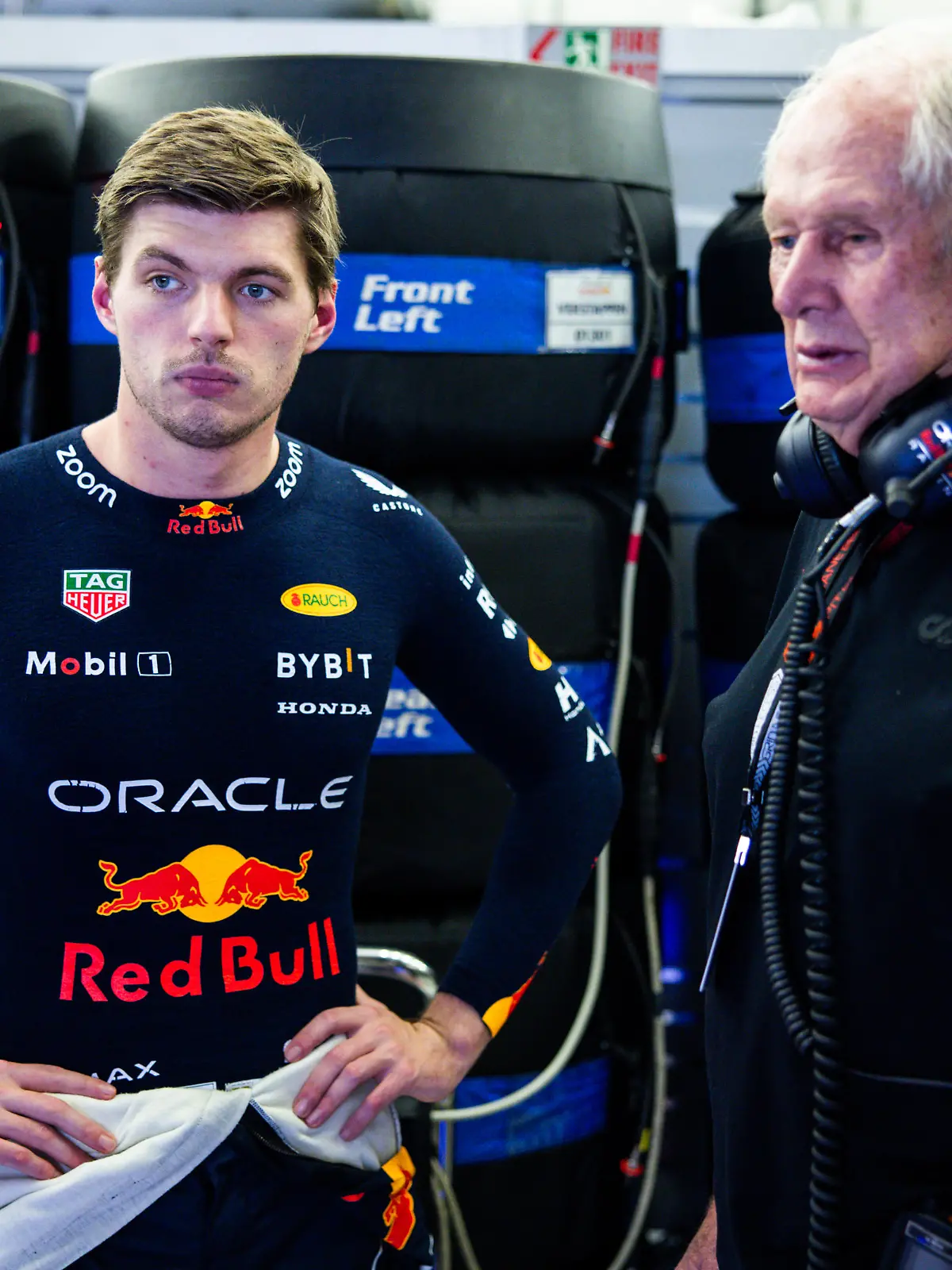 BAHRAIN, BAHRAIN - FEBRUARY 21: Max Verstappen of the Netherlands and Oracle Red Bull Racing talks with Red Bull Racing Team Consultant Dr Helmut Marko in the garage during day one of F1 Testing at Bahrain International Circuit on February 21, 2024 in Bahrain, Bahrain. (Photo by Mark Thompson/Getty Images)