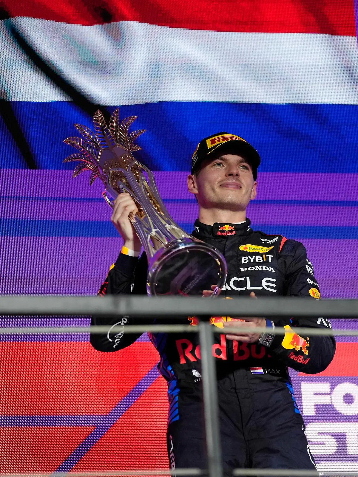 Red Bull driver Max Verstappen of the Netherlands celebrates after winning the Formula One Saudi Arabian Grand Prix at the Jeddah Corniche Circuit, in Jedda, Saudi Arabia, Saturday, March 9, 2024. (AP Photo/Darko Bandic)