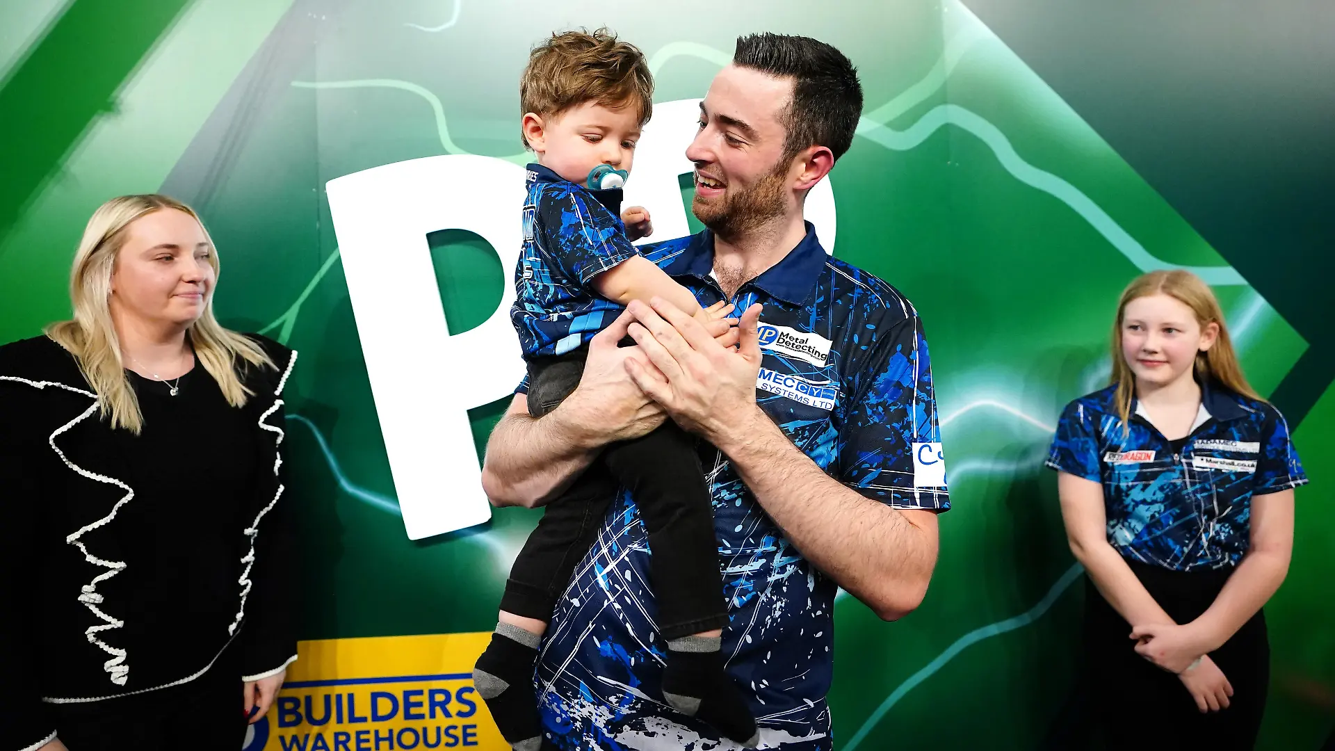 Paddy Power World Darts Championship 2023/24 - Final - Alexandra Palace. Luke Humphries celebrates with his family after winning the final of the Paddy Power World Darts Championship against Luke Littler at Alexandra Palace, London. Picture date: Wednesday January 3, 2024. See PA story DARTS World. Photo credit should read: Zac Goodwin/PA Wire. RESTRICTIONS: Use subject to restrictions. Editorial use only, no commercial use without prior consent from rights holder. URN:74988717