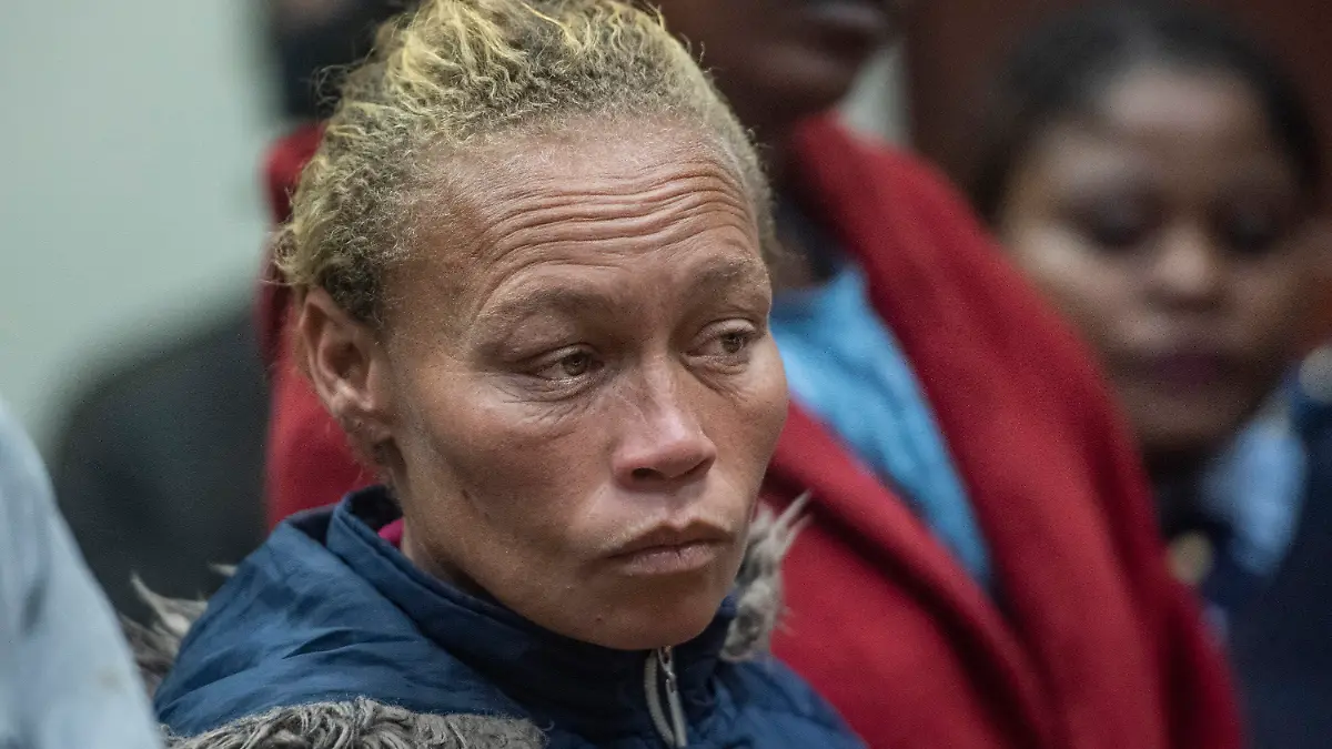 CAPTION CORRECTS DATE The mother of missing 6-year-old Joslin Smith, Kelly Smith, appears in court in Vredenburg, South Africa, Thursday, March 7, 2024. Smith has been charged with kidnapping and selling or trafficking her daughter in a shocking twist in a case that has enraptured the country and sparked deep anger in the small, poor coastal community where the family lives. (AP Photo)