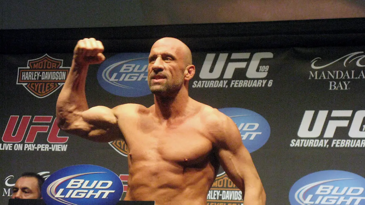 FILE - UFC Hall of Famer Mark Coleman gestures during the weigh-in ahead of his UFC 109 fight against Randy Couture Friday, Feb. 5, 2010, in Las Vegas. Former UFC champion Mark Coleman was airlifted to a hospital and was “battling for his life” after saving his parents from a house fire in Ohio this week, his daughter said on Instagram. Morgan Coleman posted Tuesday night, March 12, 2024, that her father went into the burning house several times and was able to bring out his mother and father. (Neil Davidson/The Canadian Press via AP, File)
