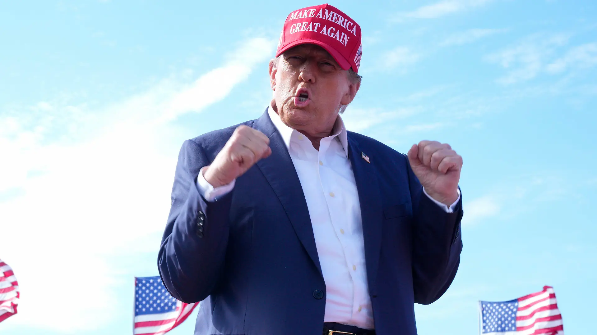 Republican presidential candidate former President Donald Trump gestures to the crowd at a campaign rally Saturday, March 16, 2024, in Vandalia, Ohio. (AP Photo/Jeff Dean)