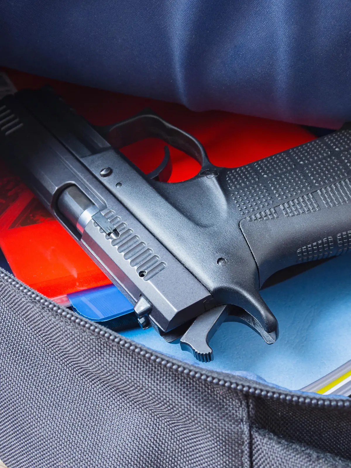 Loaded 9mm pistol in the school backpack. School shootings, gun control concept image.