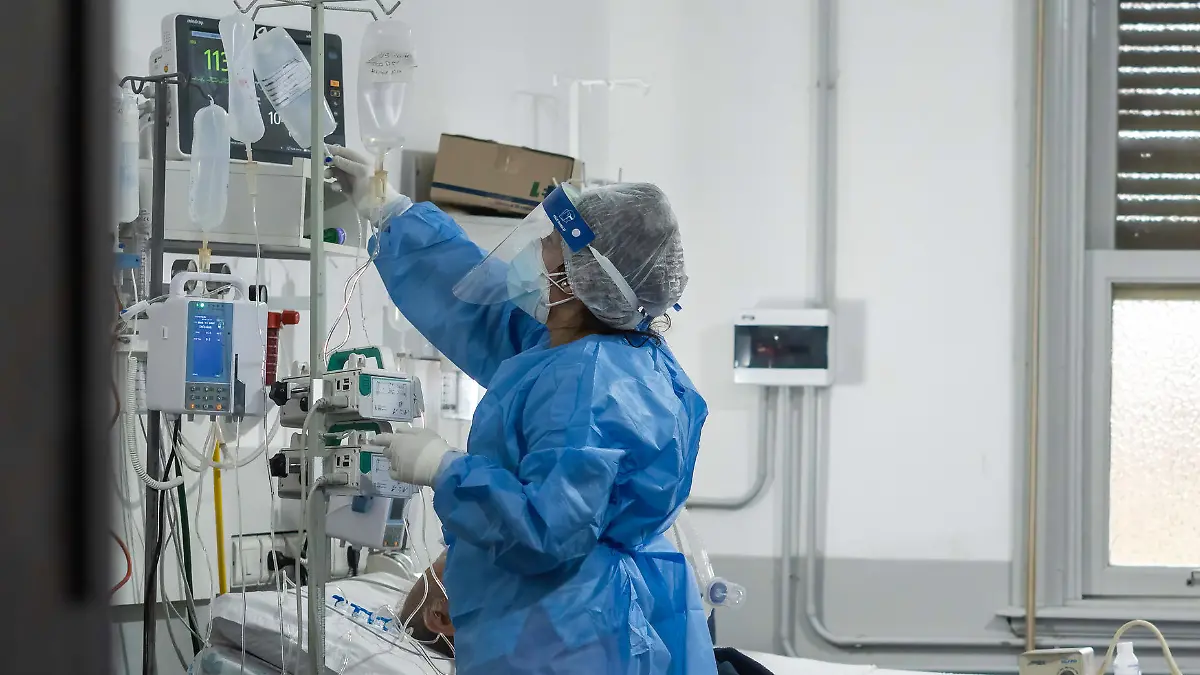 May 19, 2021, Firmat, Santa Fe, Argentina: A nurse wearing a Personal Protective Equipment suite (PPE) checks on infected patients inside the covid-19 intensive care unit (ICU) in Hospital San Martin..The second wave of COVID-19 is hitting hard, with the country reaching record of deaths and contagions, the health system of the Province of Santa Fe has 90% of occupation, and both Federal and Provincial Governments have placed strict restrictions to try to control de virus spread. (Credit Image: © Patricio Murphy/SOPA Images via ZUMA Wire