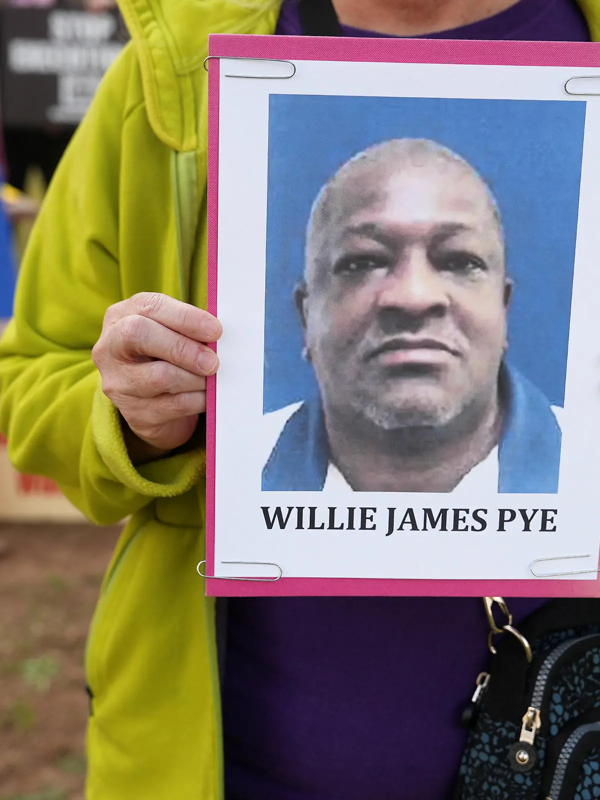 Cathy Harmon-Christian, the executive director of 'Georgians for Alternatives to the Death Penalty', holds a photo of Willie James Pye outside of the Georgia Diagnostic Prison in Jackson, Georgia, U.S. March 20, 2024. REUTERS/Jayla Whitfield-Anderson