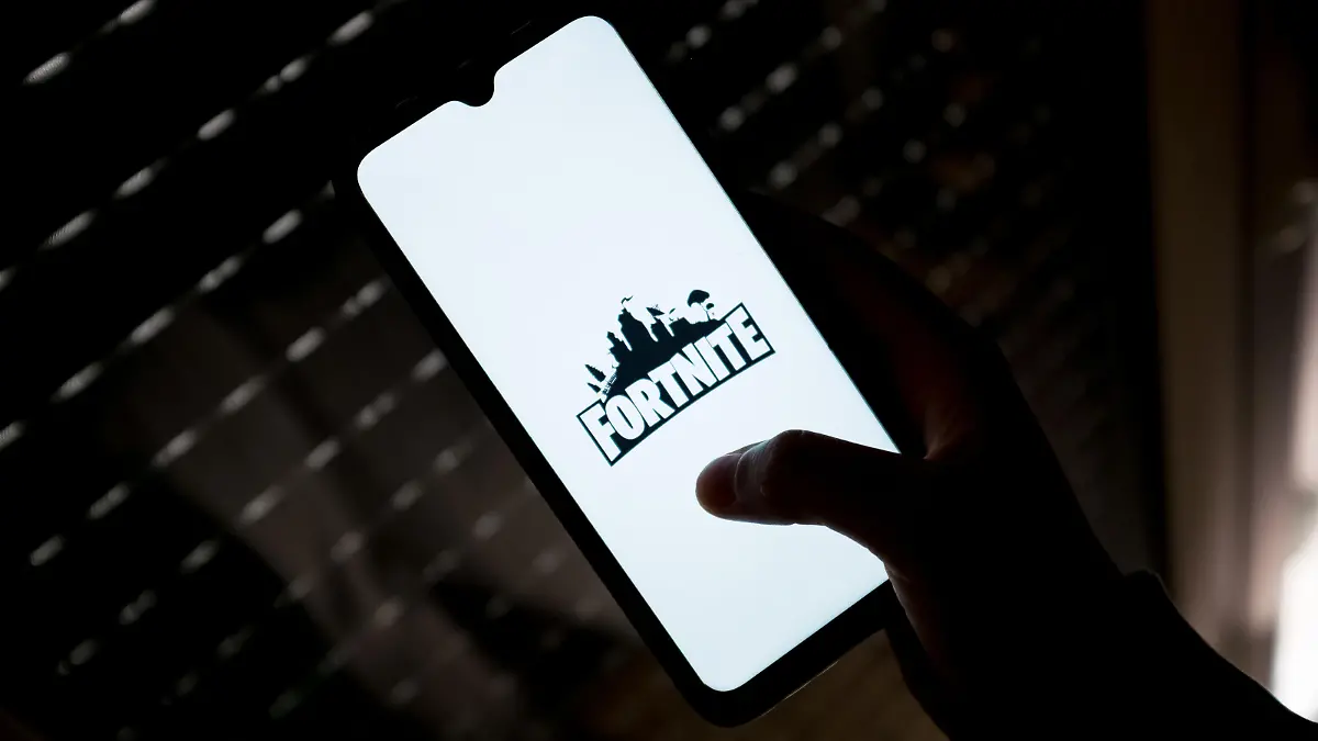 In this photo illustration a Fortnite logo seen displayed on a smartphone screen in Athens, Greece on May 11, 2022. (Photo illustration by Nikolas Kokovlis/NurPhoto)