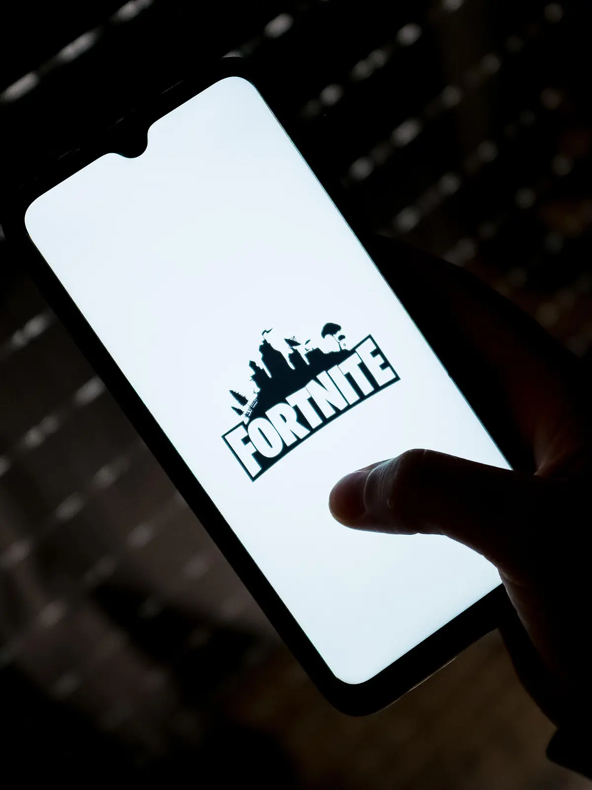 In this photo illustration a Fortnite logo seen displayed on a smartphone screen in Athens, Greece on May 11, 2022. (Photo illustration by Nikolas Kokovlis/NurPhoto)