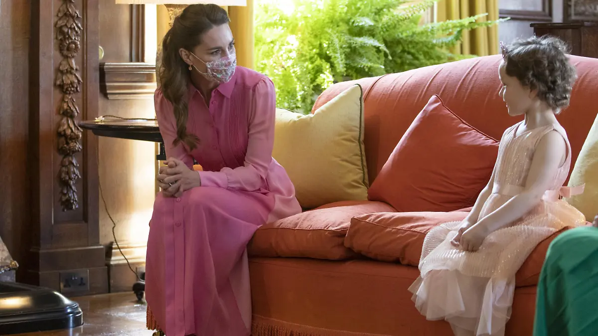 Duke and Duchess of Cambridge tour of Scotland. The Duchess of Cambridge meeting Mila Sneddon, aged five, at the Palace of Holyroodhouse in Edinburgh. Cancer patient Mila features in an image from the Hold Still photography project which showed her kissing her father Scott through a window whilst she was shielding during her chemotherapy treatment. Picture date: Thursday May 27, 2021. See PA story ROYAL Cambridge. Photo credit should read: Jane Barlow/PA Wire URN:60044601