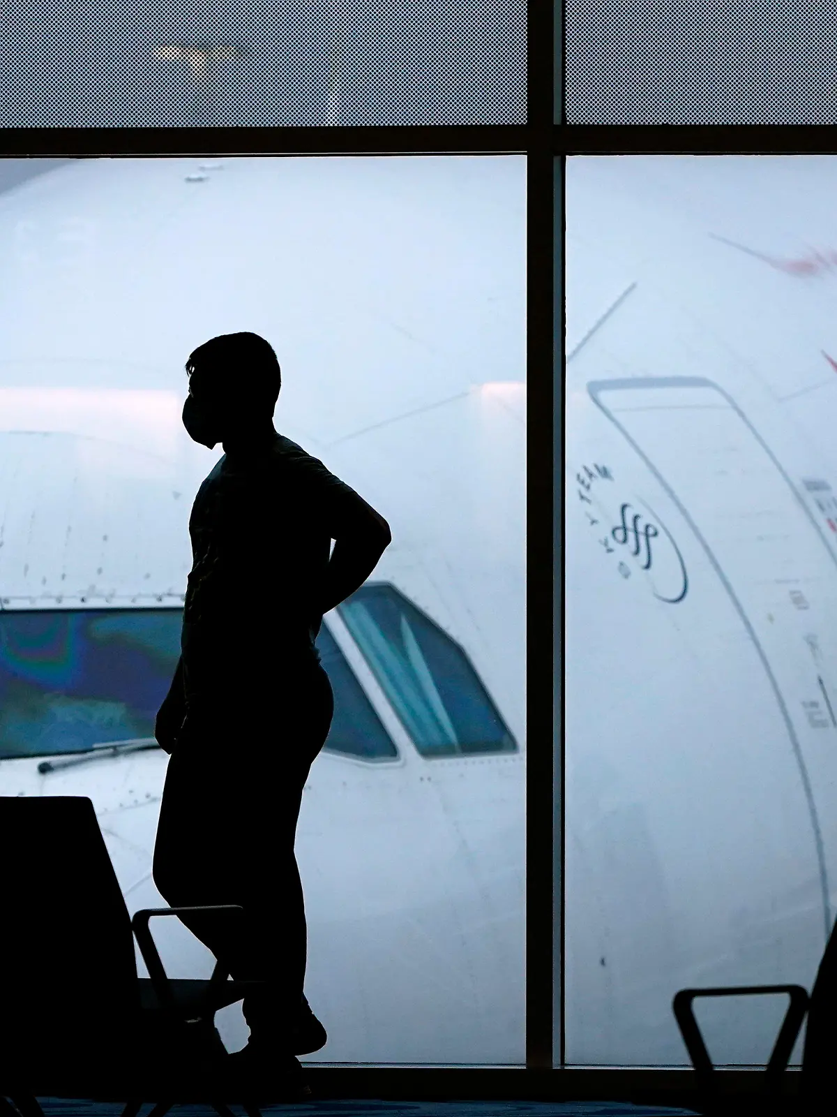 FILE - A passenger waits for a Delta Airlines flight at Hartsfield-Jackson International Airport in Atlanta on Feb. 18, 2021. The U.S. Department of Transportation said Thursday, March 21, 2024, that it will review how airlines protect personal information about their passengers and whether they are making money by sharing that information with other parties. (AP Photo/Charlie Riedel, File)