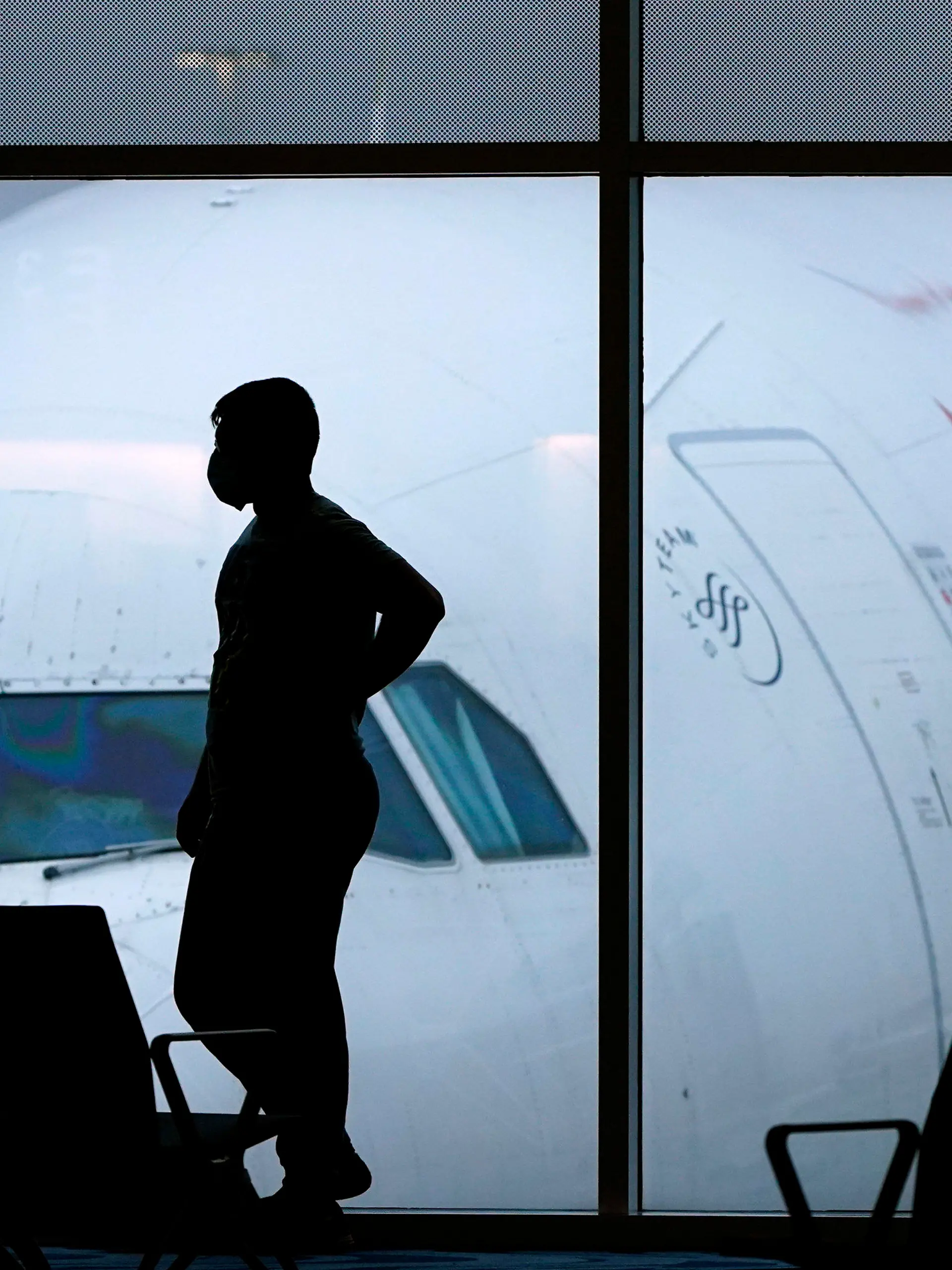 FILE - A passenger waits for a Delta Airlines flight at Hartsfield-Jackson International Airport in Atlanta on Feb. 18, 2021. The U.S. Department of Transportation said Thursday, March 21, 2024, that it will review how airlines protect personal information about their passengers and whether they are making money by sharing that information with other parties. (AP Photo/Charlie Riedel, File)