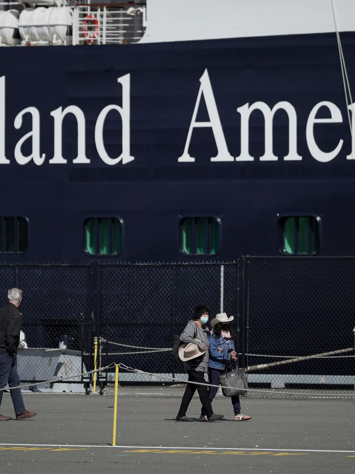 FILE - A Holland America cruise ship is shown in Victoria, Canada on Saturday, April 9, 2022.  Two crew members on a Holland America cruise ship died during an “incident” in the ship's engineering space, the cruise line said.
The unidentified crew members died Friday, March 22, 2024, while the Florida-based Nieuw Amsterdam was at Half Moon Cay in the Bahamas, Holland America said in a statement.(Darryl Dyck/The Canadian Press via AP)