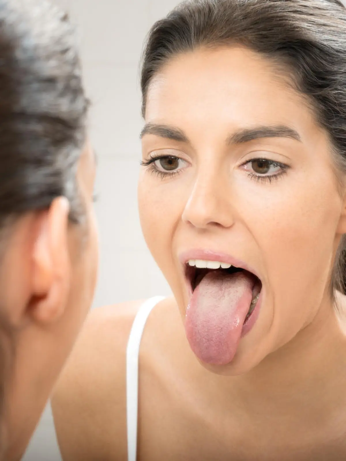 Woman sticking out Tongue