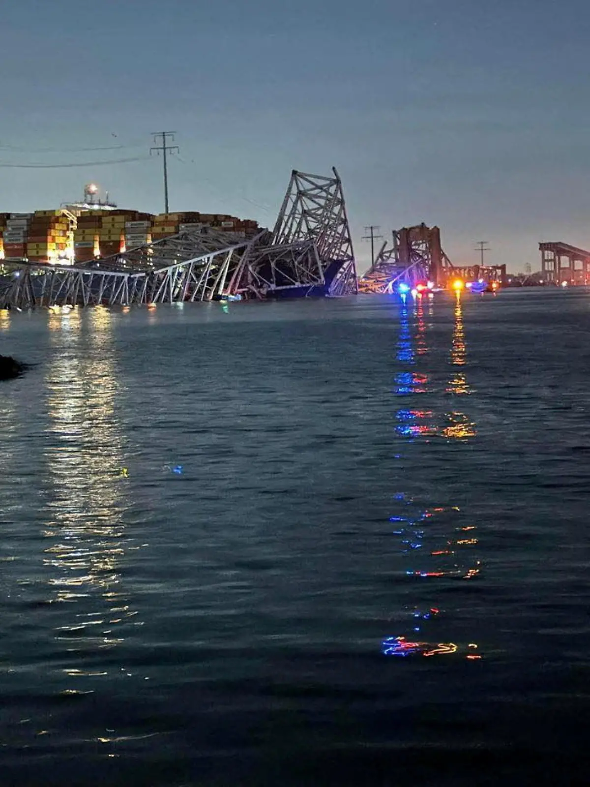 A view of the Singapore-flagged container ship 'Dali' after it collided with a pillar of the Francis Scott Key Bridge in Baltimore, Maryland, U.S., in this picture released on March 26, 2024. Harford County MD Fire & EMS/Handout via REUTERS  THIS IMAGE HAS BEEN SUPPLIED BY A THIRD PARTY NO RESALES. NO ARCHIVES MANDATORY CREDIT      TPX IMAGES OF THE DAY
